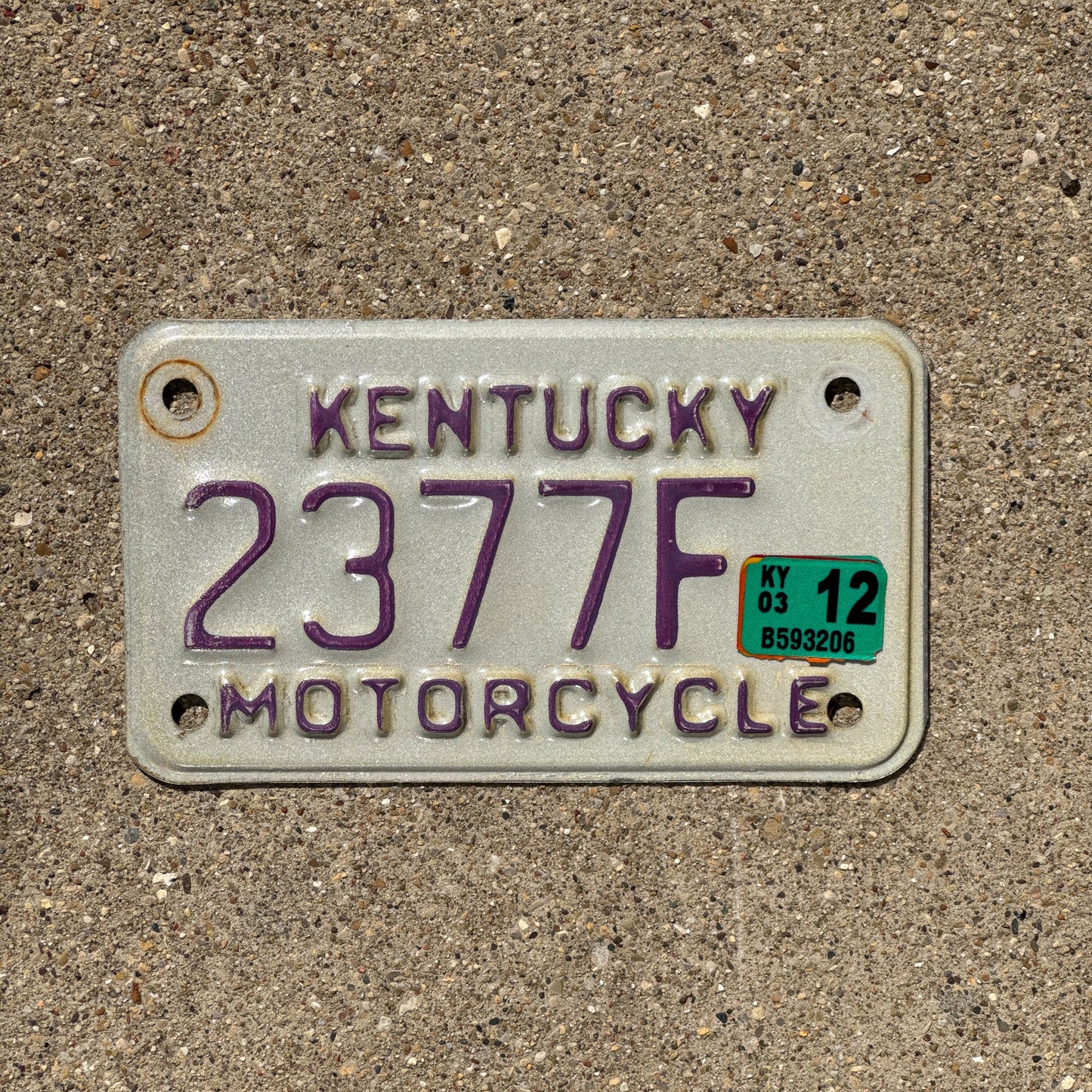 Photo of a 1998 Kentucky MOTORYCLE License Plate Auto Tag Garage Decor Vintage White Purple 2377F
