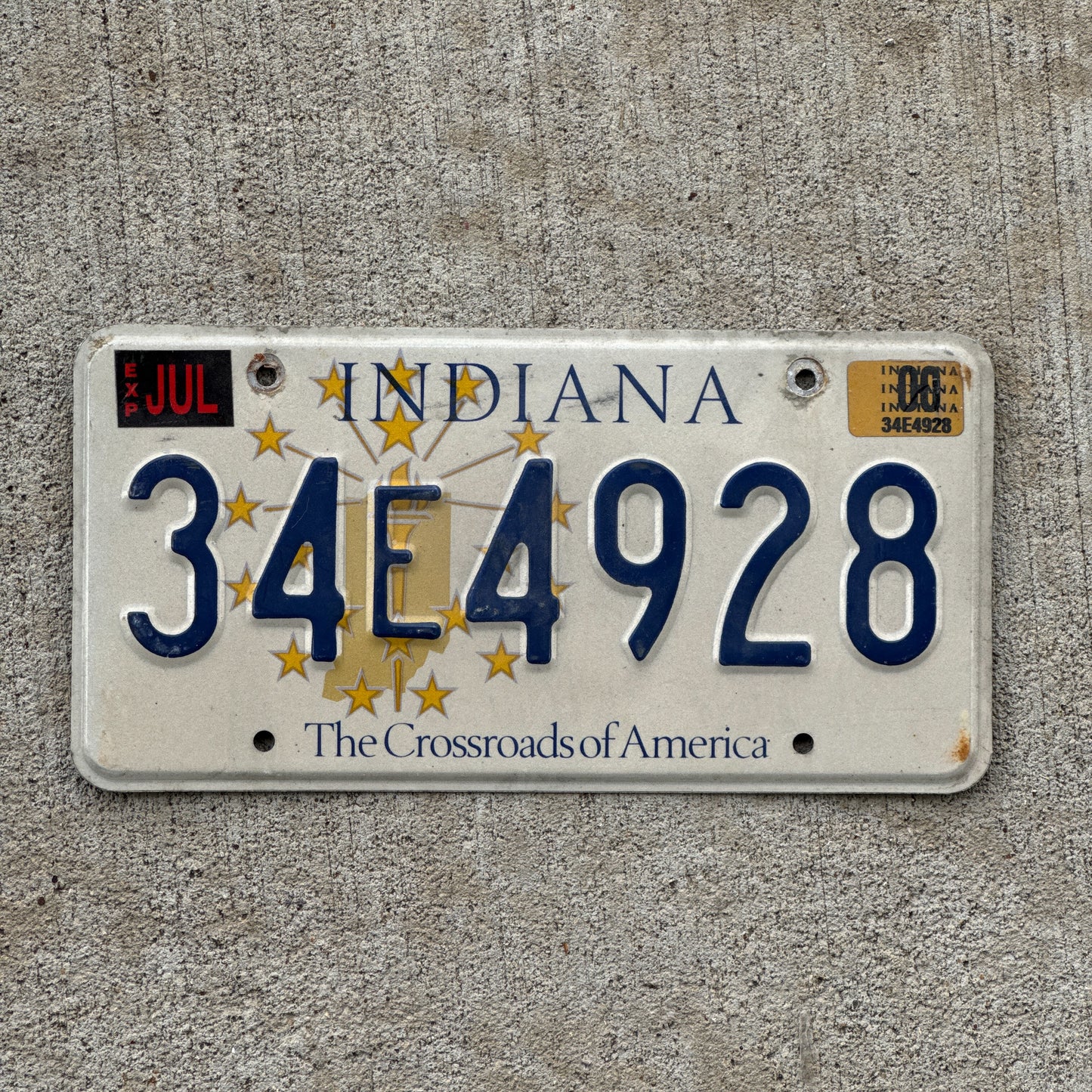 Photo of a 1999 2000 Indiana License Plate Auto Tag Garage Decor Vintage 34 E 4928 with original patina