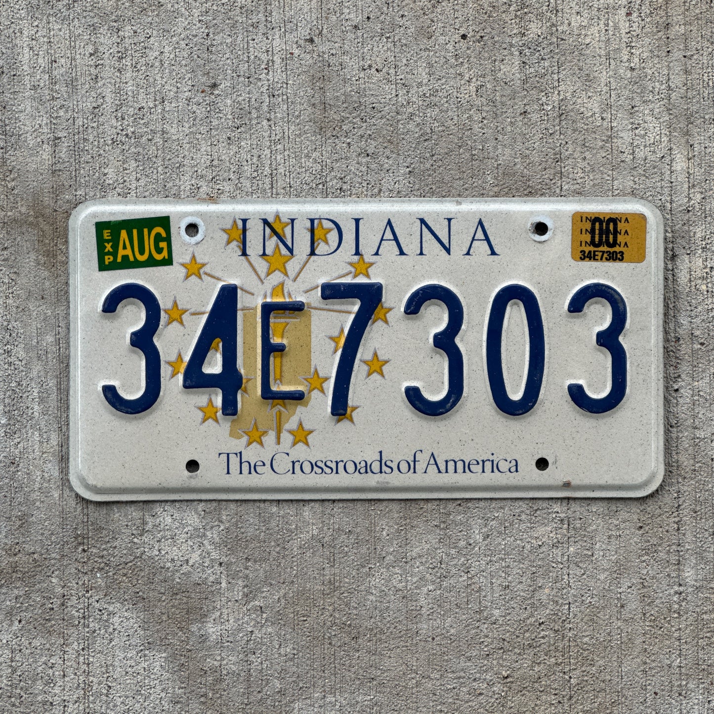Photo of a 1999 2000 Indiana License Plate Auto Tag Garage Decor Vintage 34 E 7303 with original patina