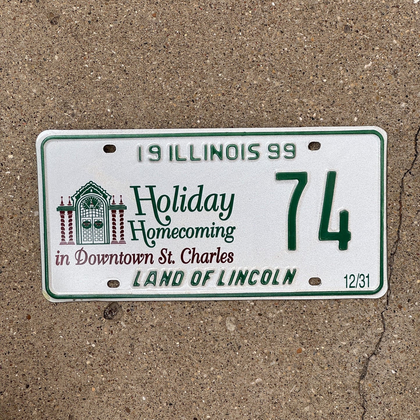 Photo of a 1999 Illinois EVENT License Plate Auto Tag Garage Decor Vintage St Charles Christmas 74