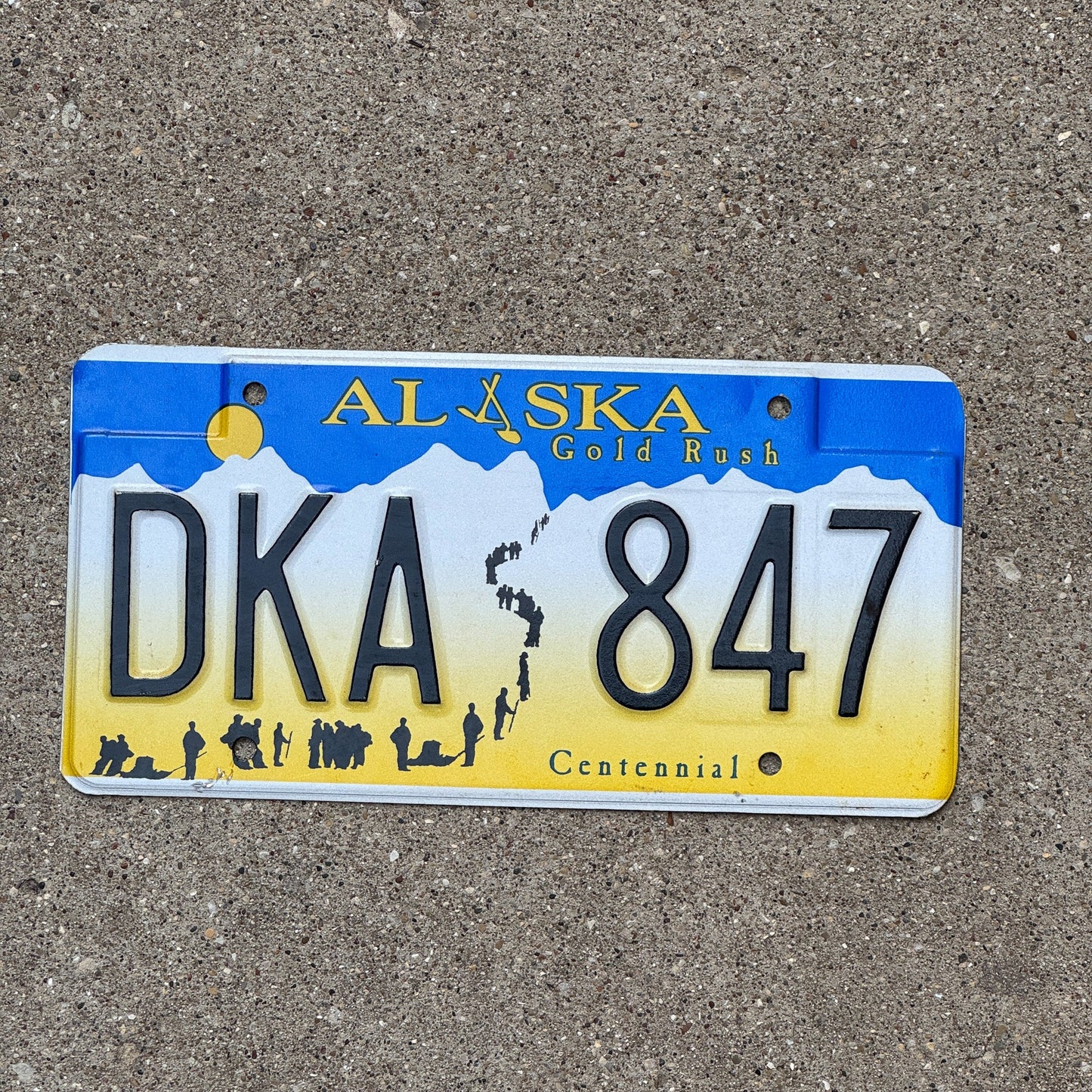 Photo of a 2000 Alaska License Plate Auto Tag Garage Decor Vintage Gold Rush Centennial DKA 847