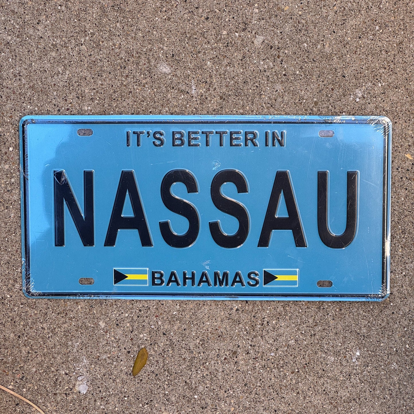 Photo of a 2000 Era Bahamas Souvenir License Plate Booster License Plate Auto Tag Garage Decor Vintage NASSAU with original patina