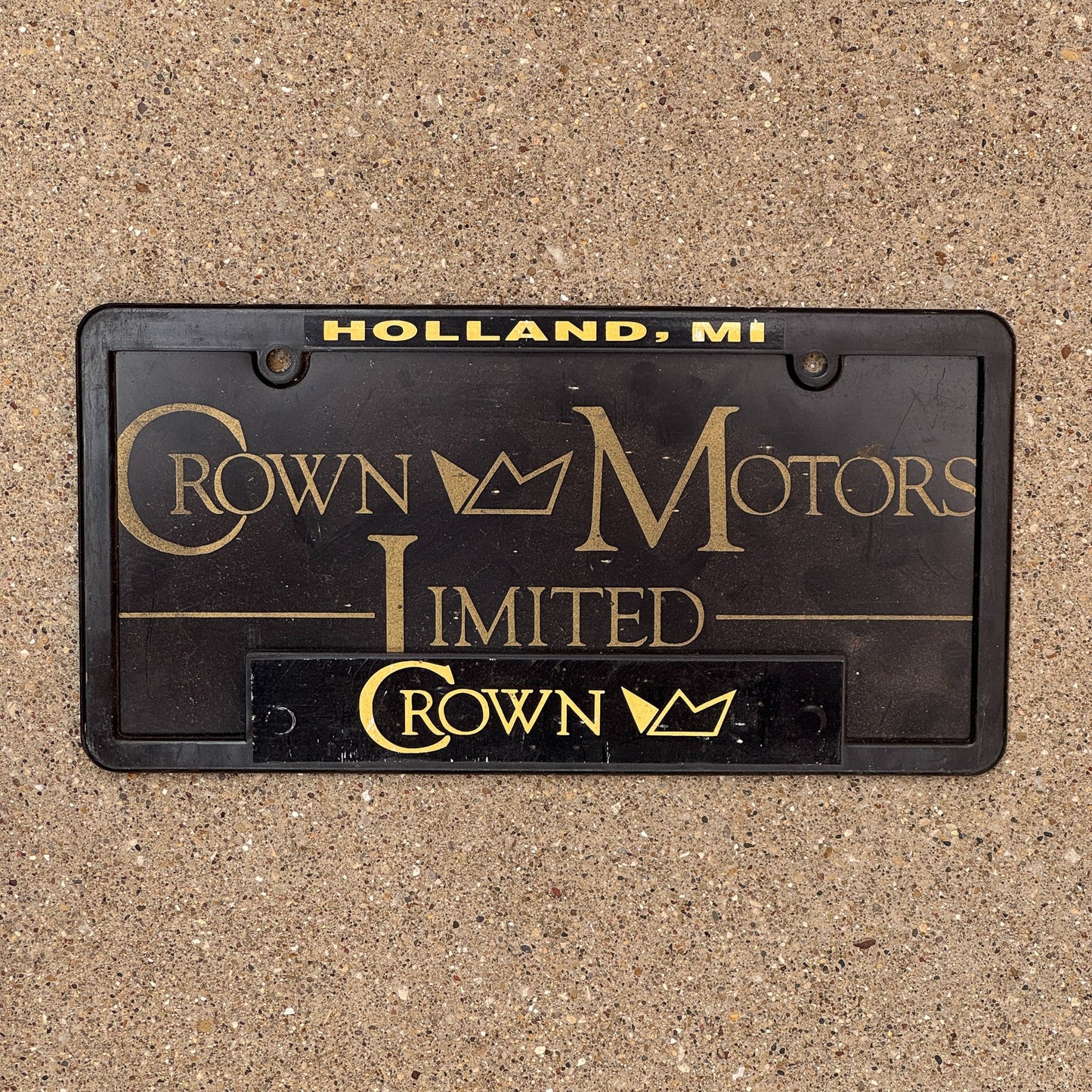 Photo of a 2000 Era Michigan Auto Tag Garage Decor Vintage Crown Motors Limited Holland MI