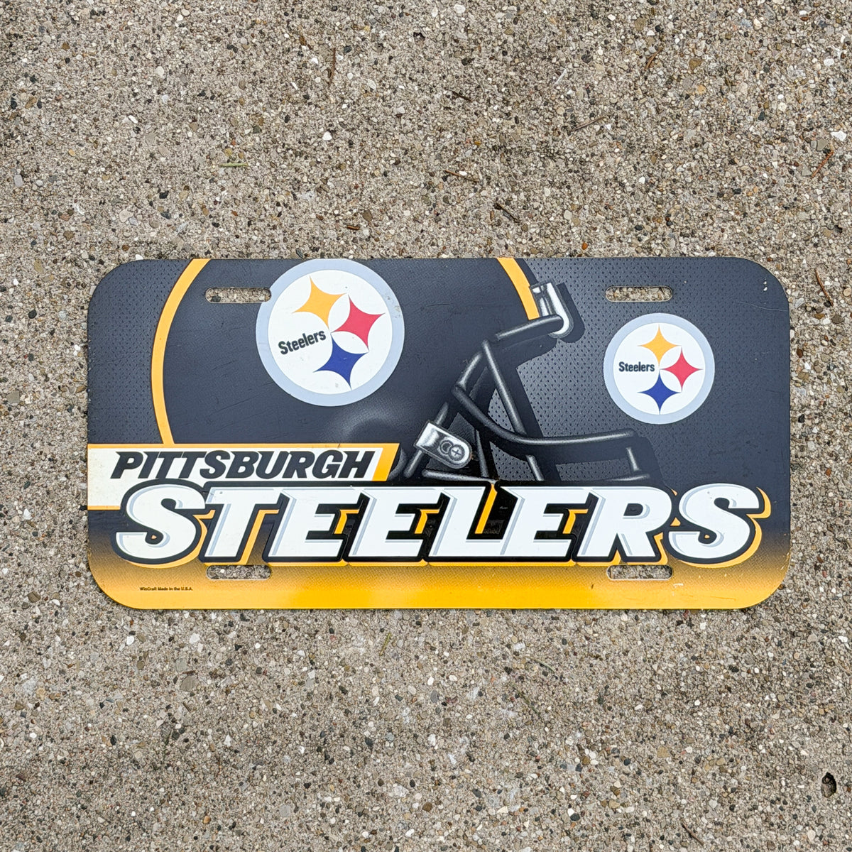 Photo of a 2000 Era Pittsburgh Pennsylvania Booster License Plate Auto Tag Garage Decor Vintage Steelers NFL Football Sports Plastic with original patina