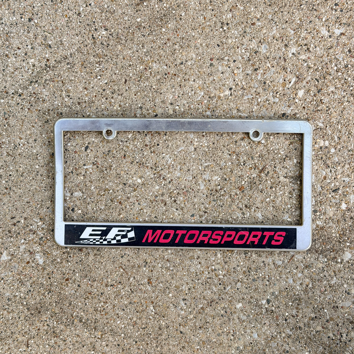 Photo of a 2000 Era Virginia License Plate Frame Auto Tag Garage Decor Vintage EF Motorsports Racing Plastic with original patina
