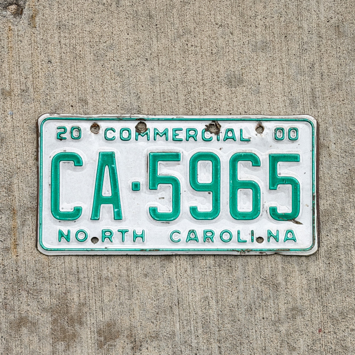 Photo of a 2000 North Carolina Commercial License Plate Auto Tag Garage Decor Vintage CA 5965 with original patina