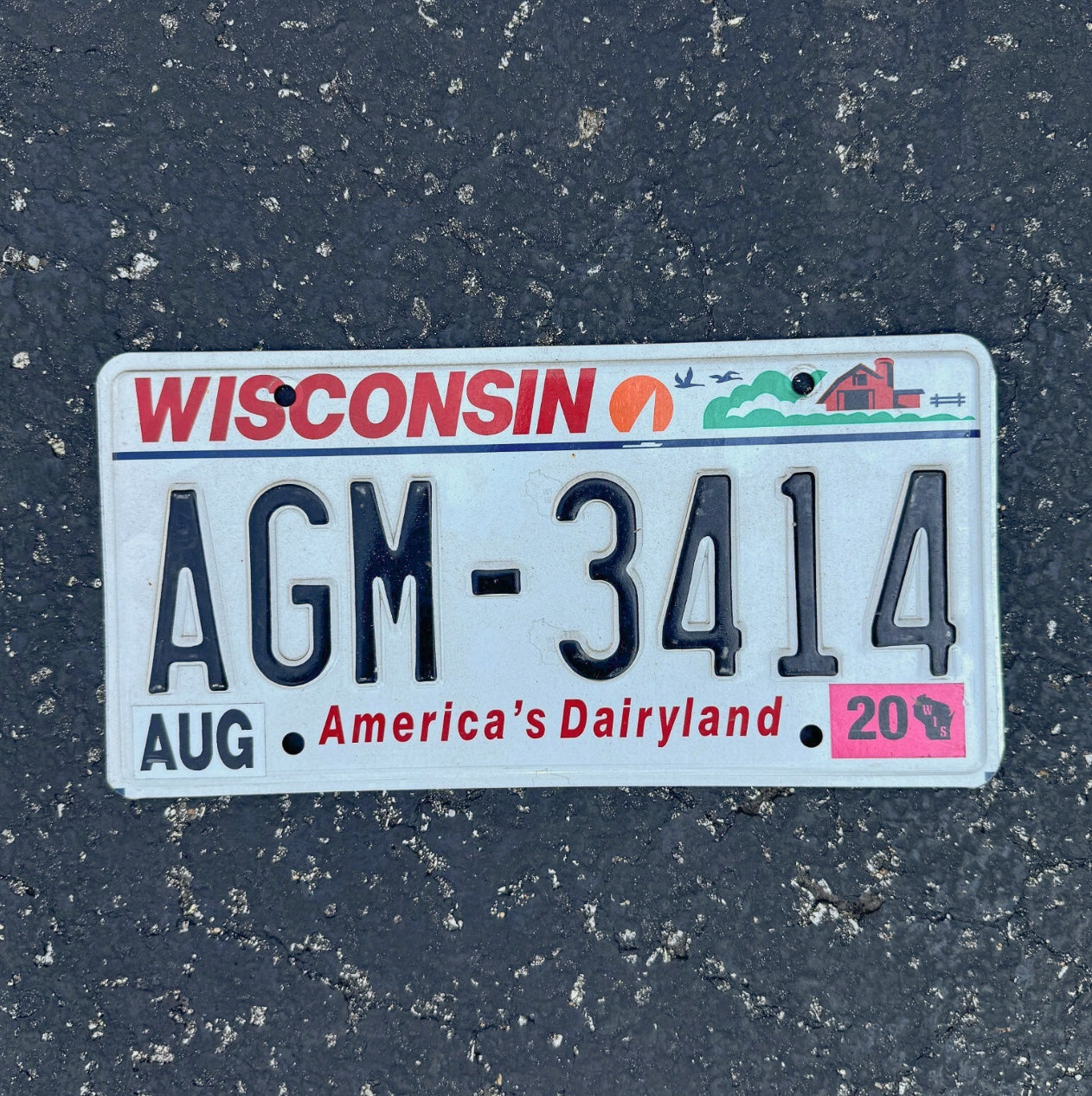 Photo of a 2000 Wisconsin License Plate Auto Tag Garage Decor Vintage AGM 3414