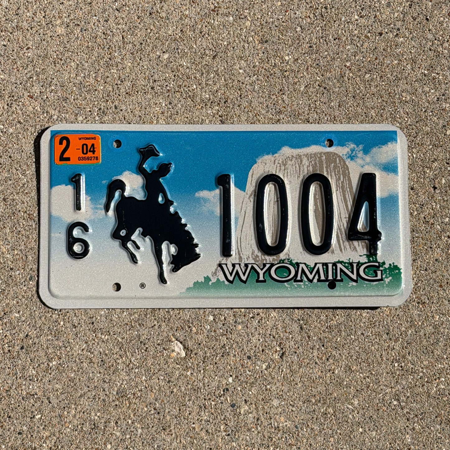 Photo of a 2001 2004 Wyoming License Plate Auto Tag Garage Decor Vintage Cowboy Rodeo 16 1004 with original patina