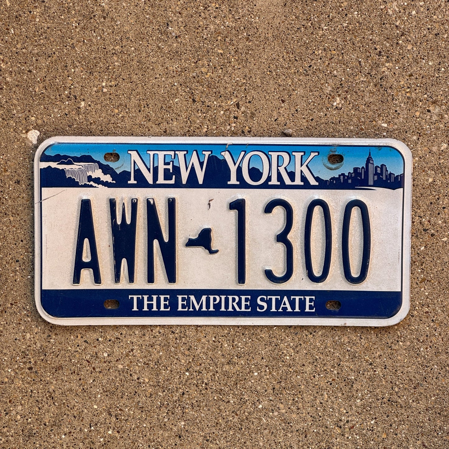 Photo of a 2001 New York License Plate Auto Tag Garage Decor Vintage AWN 1300