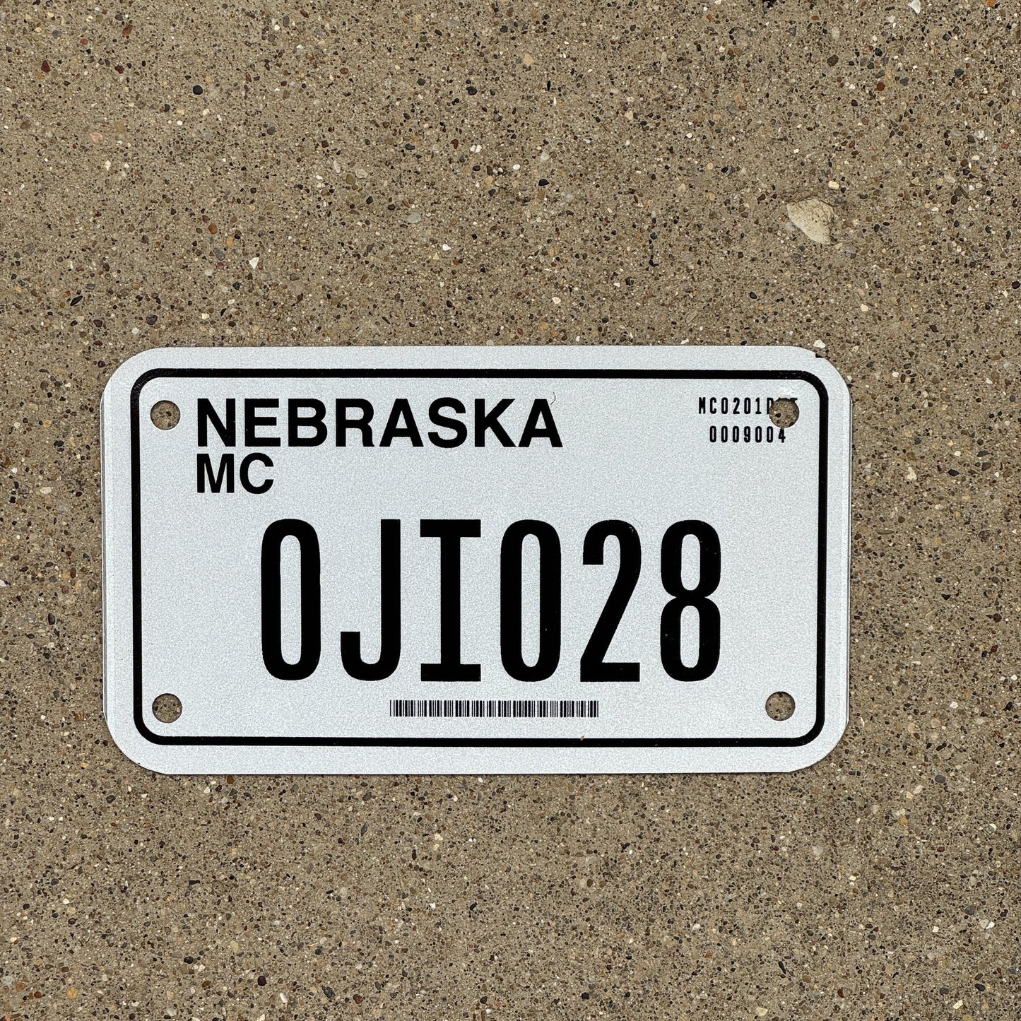 Photo of a 2002 Nebraska Motorcycle License Plate Auto Tag Garage Decor Vintage 0JI 028