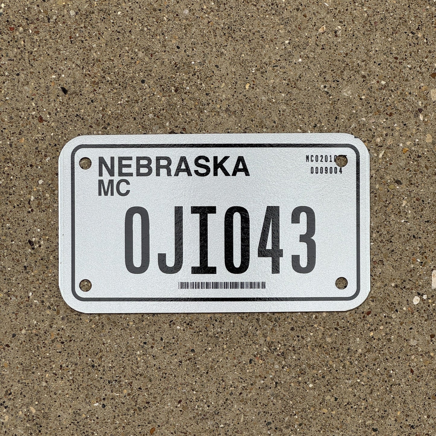 Photo of a 2002 Nebraska Motorcycle License Plate Auto Tag Garage Decor Vintage 0JI 043