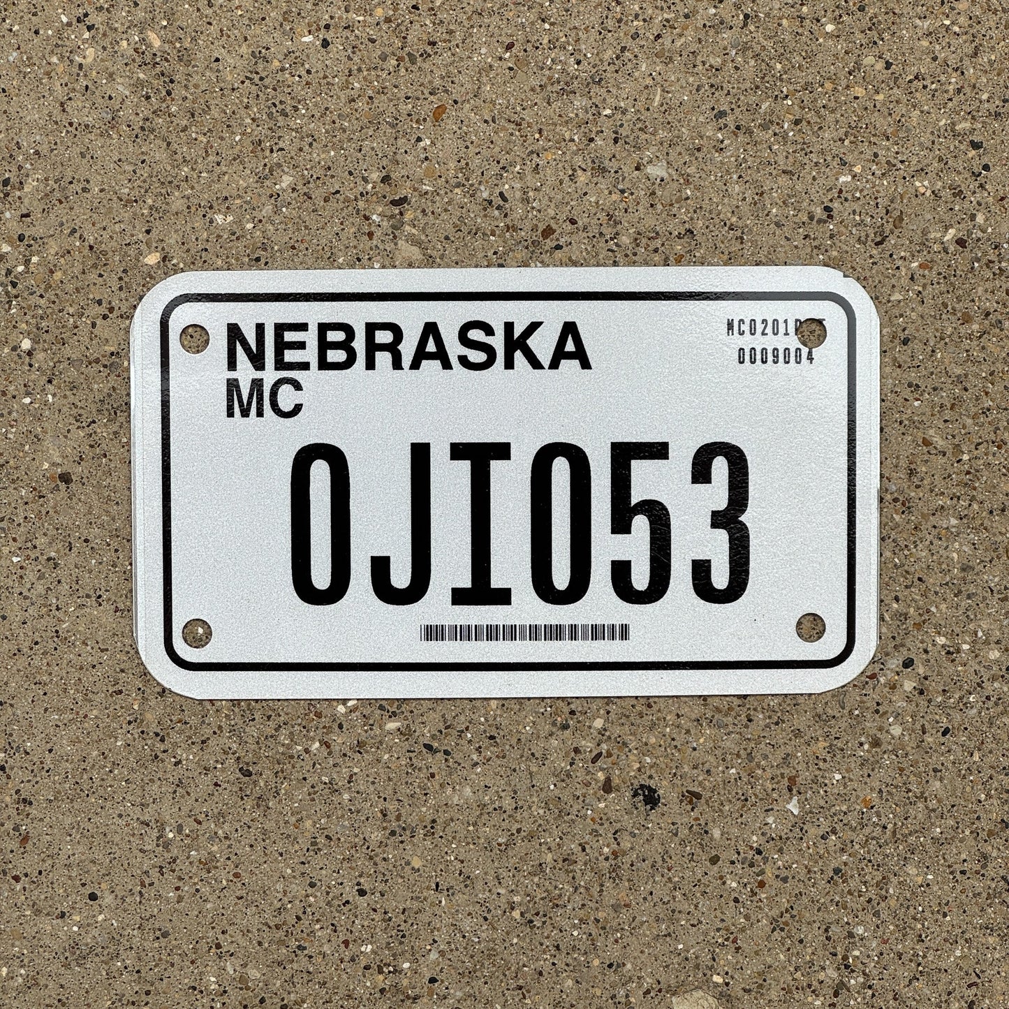 Photo of a 2002 Nebraska Motorcycle License Plate Auto Tag Garage Decor Vintage 0JI 053