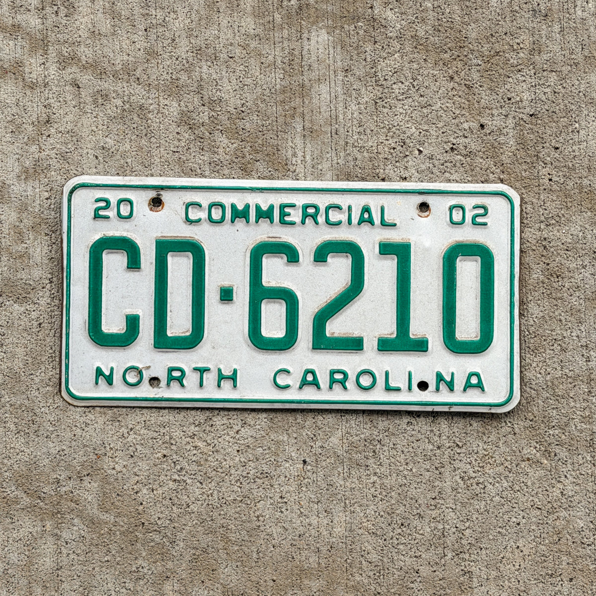 Photo of a 2002 North Carolina Commercial License Plate Auto Tag Garage Decor Vintage CD 6210 with original patina