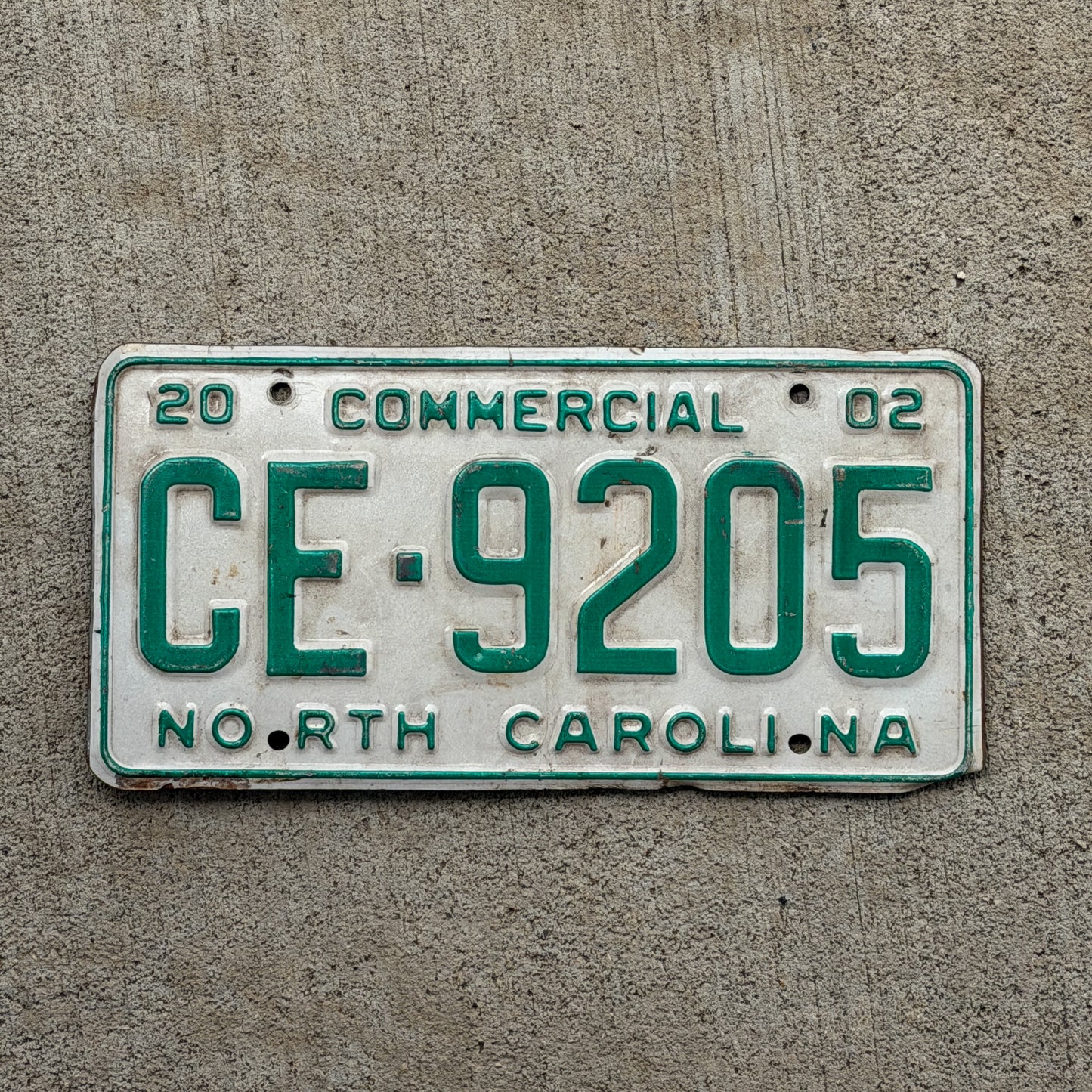 Photo of a 2002 North Carolina Commercial License Plate Auto Tag Garage Decor Vintage CE 9205 with original patina