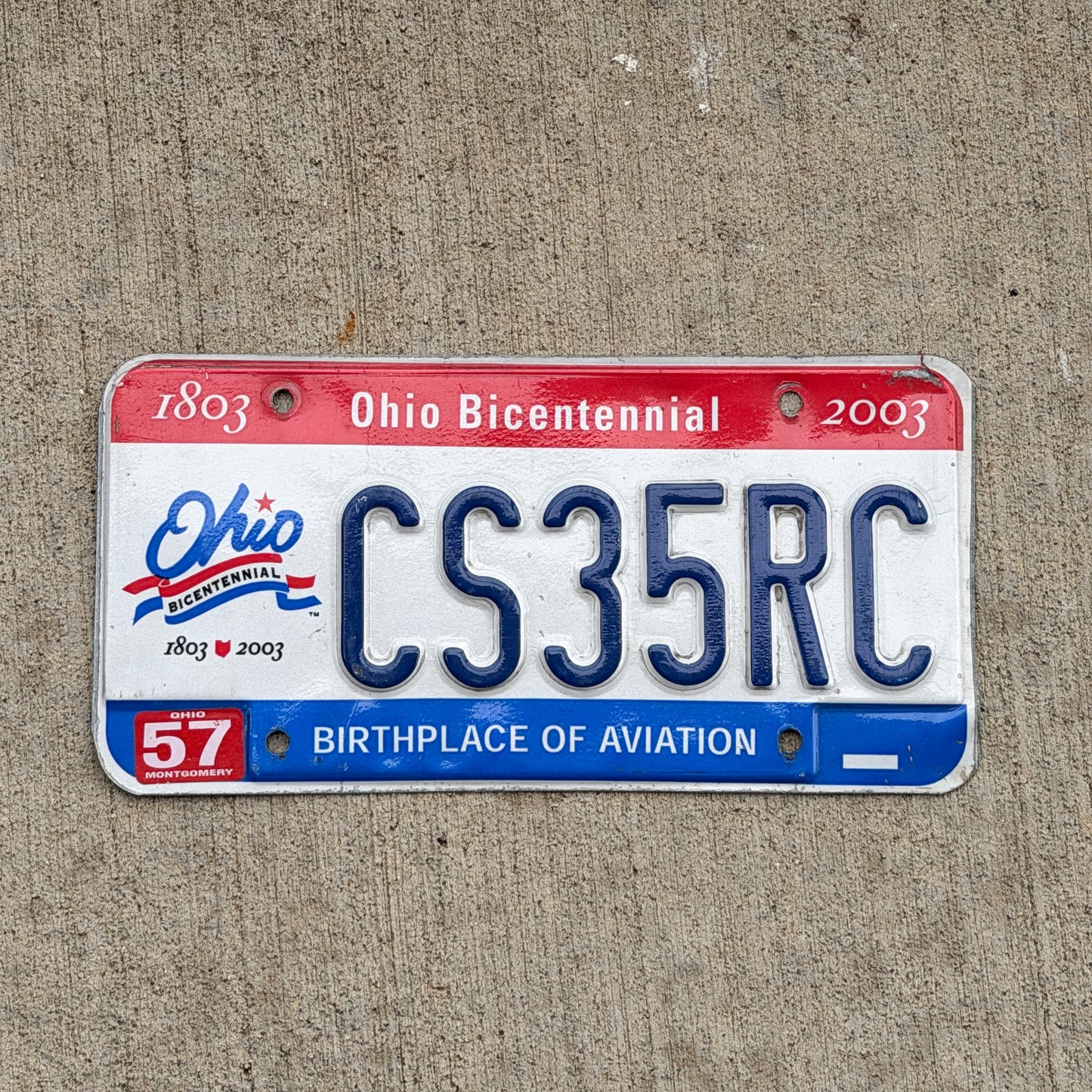 Photo of a 2002 Ohio License Plate Auto Tag Garage Decor Vintage Bicentennial CS 35 RC with original patina