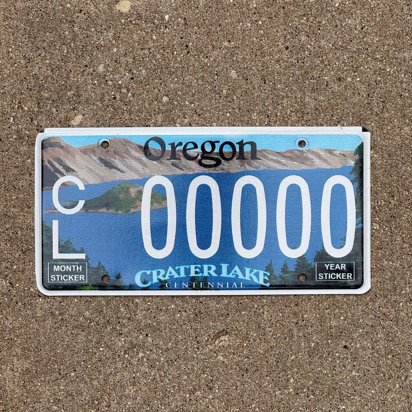 Photo of a 2002 Oregon Graphic Sample License Plate Auto Tag Garage Decor Vintage Crater Lake Centennial CL 0000