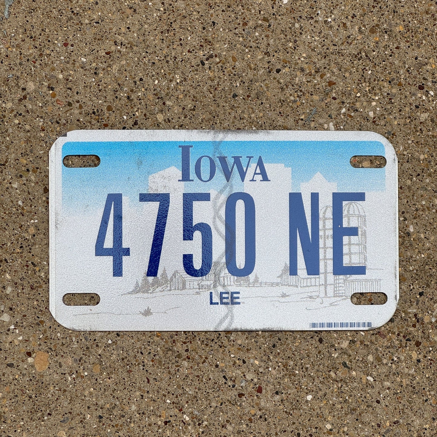 Photo of a 2003 Iowa Motorcycle License Plate Auto Tag Garage Decor Vintage Lee County 4750 NE