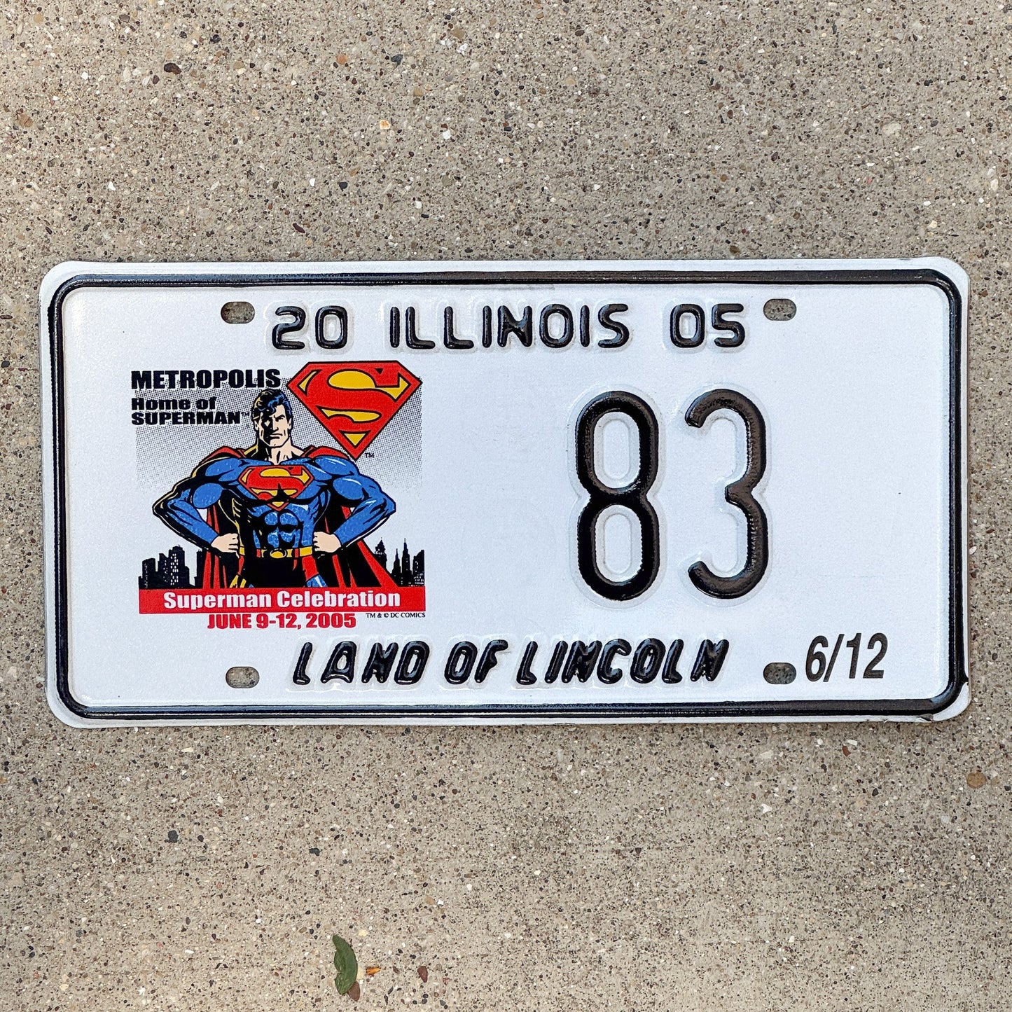 Photo of a 2005 Illinois Event License Plate Auto Tag 2 Garage Decor Metropolis Illinois Superman Comics 83 with original patina