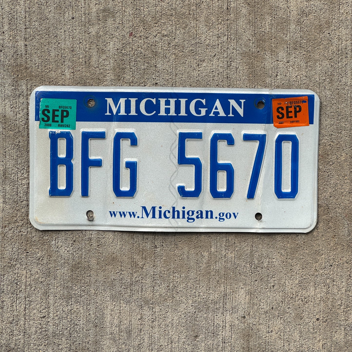 Photo of a 2006 2008 Michigan License Plate Auto Tag Garage Decor Vintage BFG 5670 with original patina