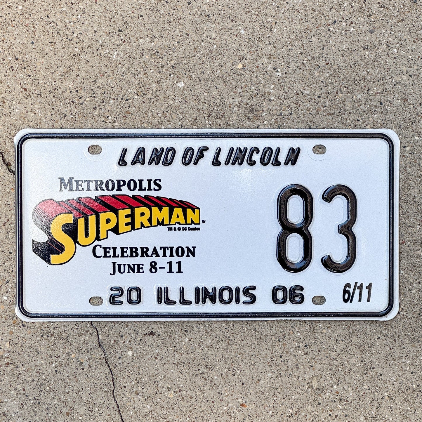 Photo of a 2006 Illinois Event License Plate Auto Tag 2 Garage Decor Metropolis Illinois Superman Comics 83 with original patina