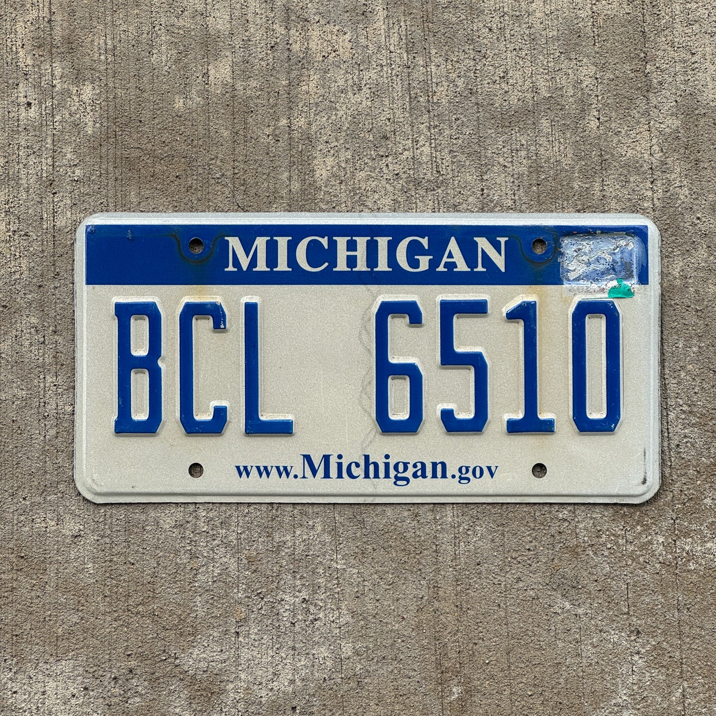 Photo of a 2006 Michigan License Plate Auto Tag Garage Decor Vintage BCL 6510 with original patina