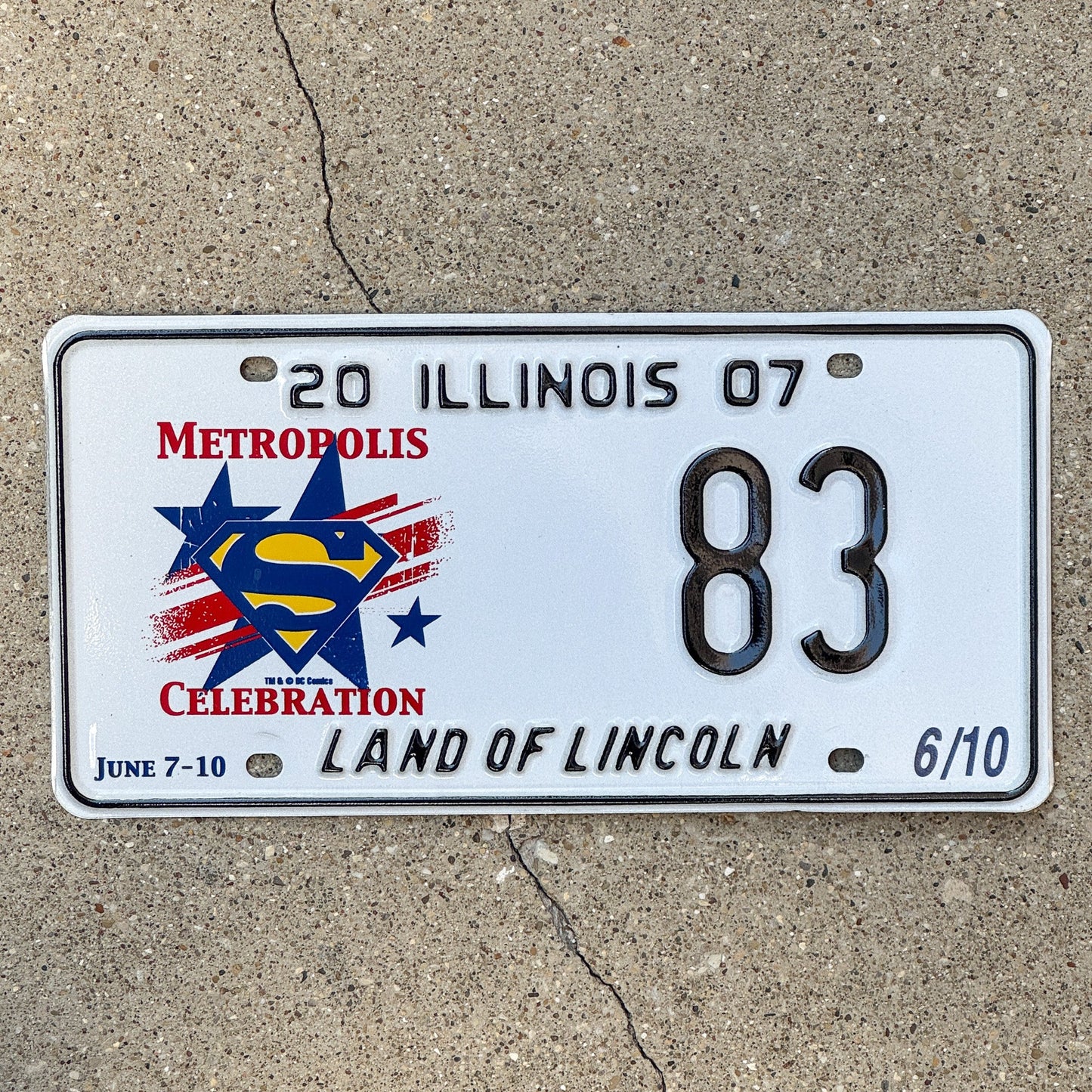 Photo of a 2007 Illinois Event License Plate Auto Tag 1 Garage Decor Metropolis Illinois Superman Comics 83 with original patina