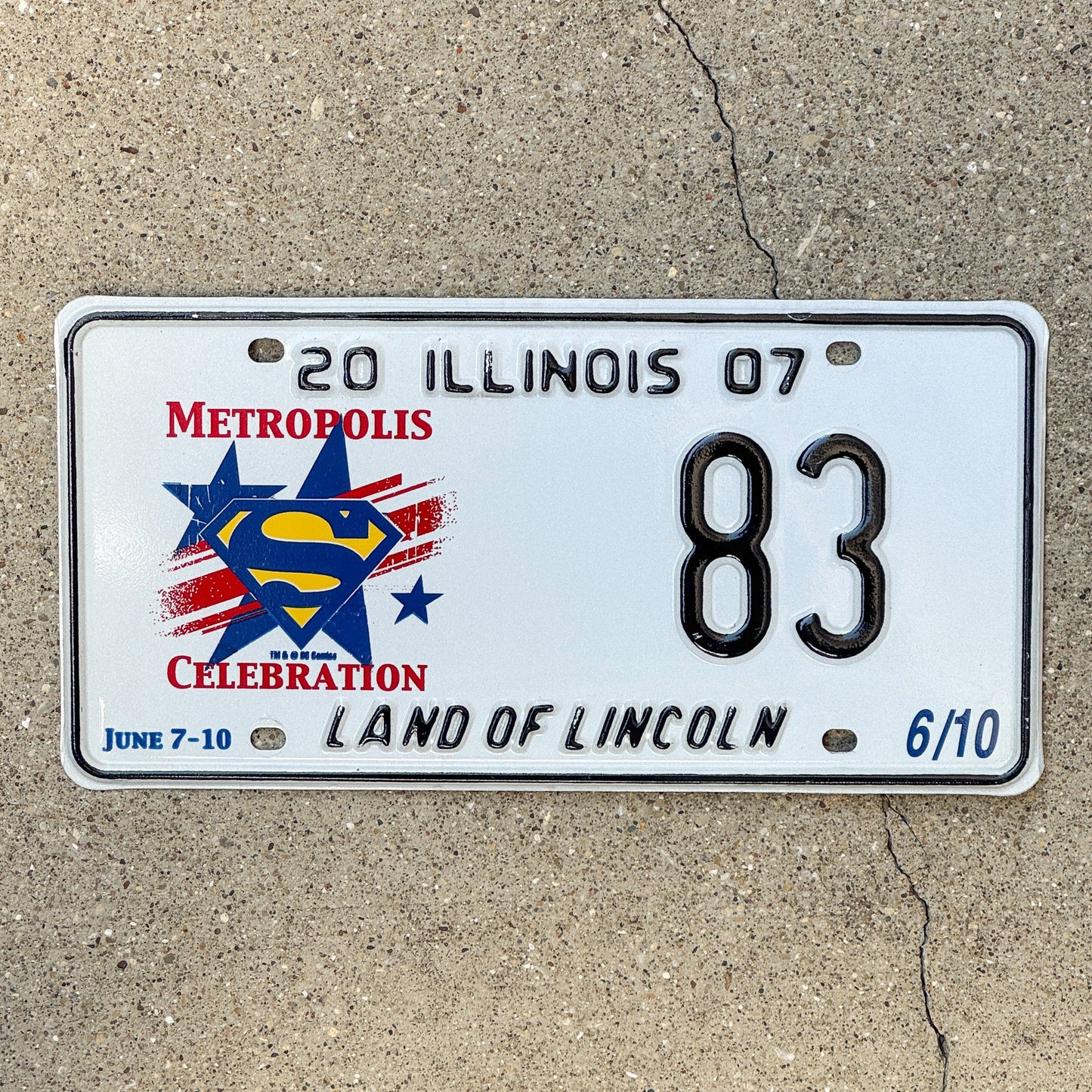 Photo of a 2007 Illinois Event License Plate Auto Tag 2 Garage Decor Metropolis Illinois Superman Comics 83 with original patina