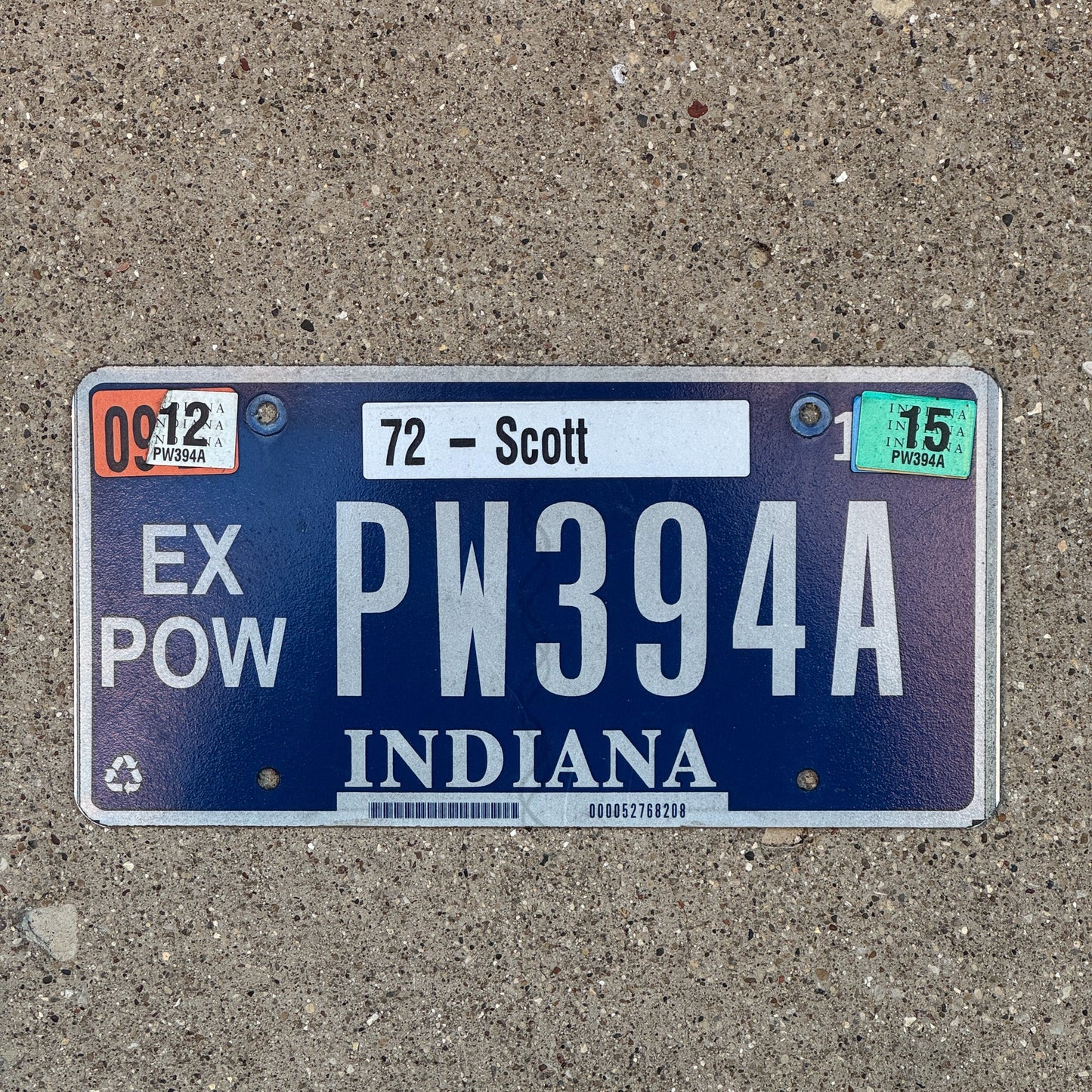 Photo of a 2009 2015 Indiana Ex Prisoner of War License Plate Auto Tag Garage Decor Vintage POW PW 394 A with original patina