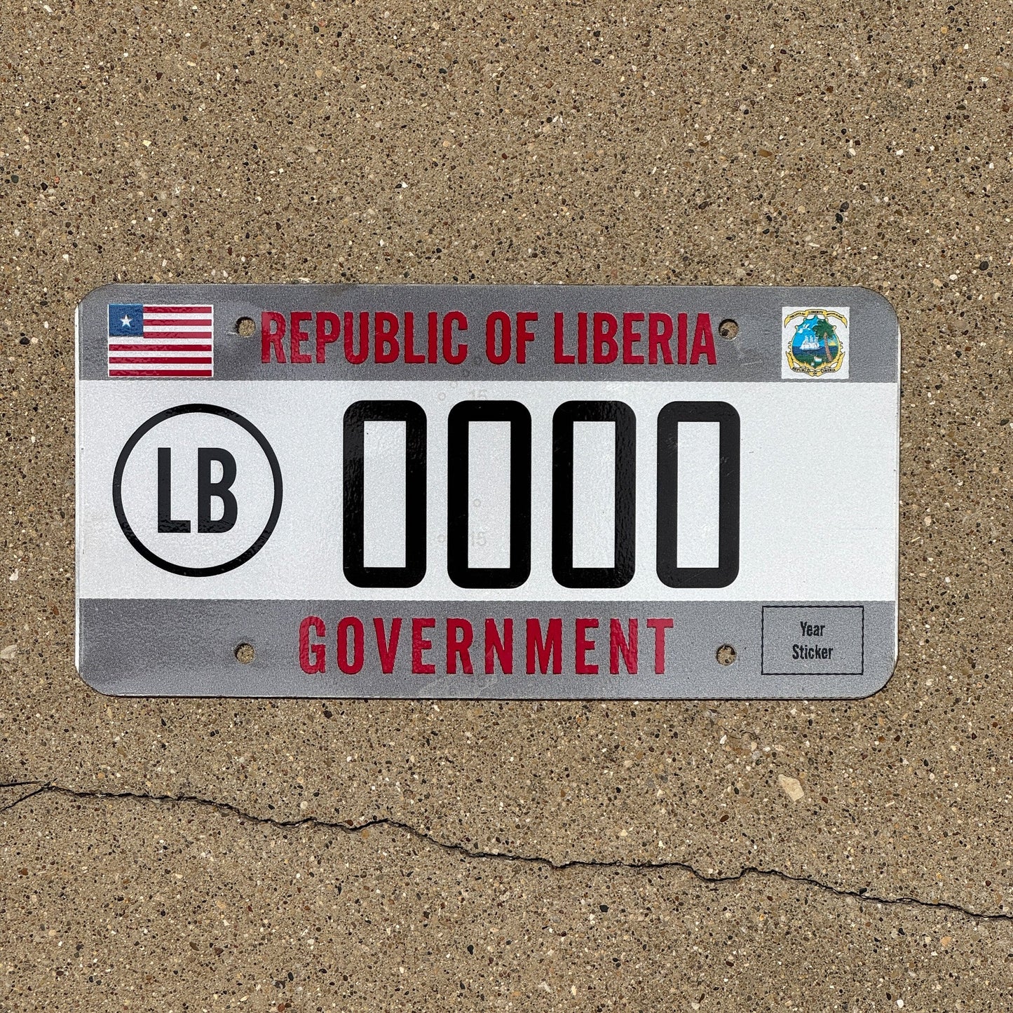 Photo of a 2010s Era Republic of Liberia Government Sample License Plate Auto Tag Garage Decor Vintage 0000