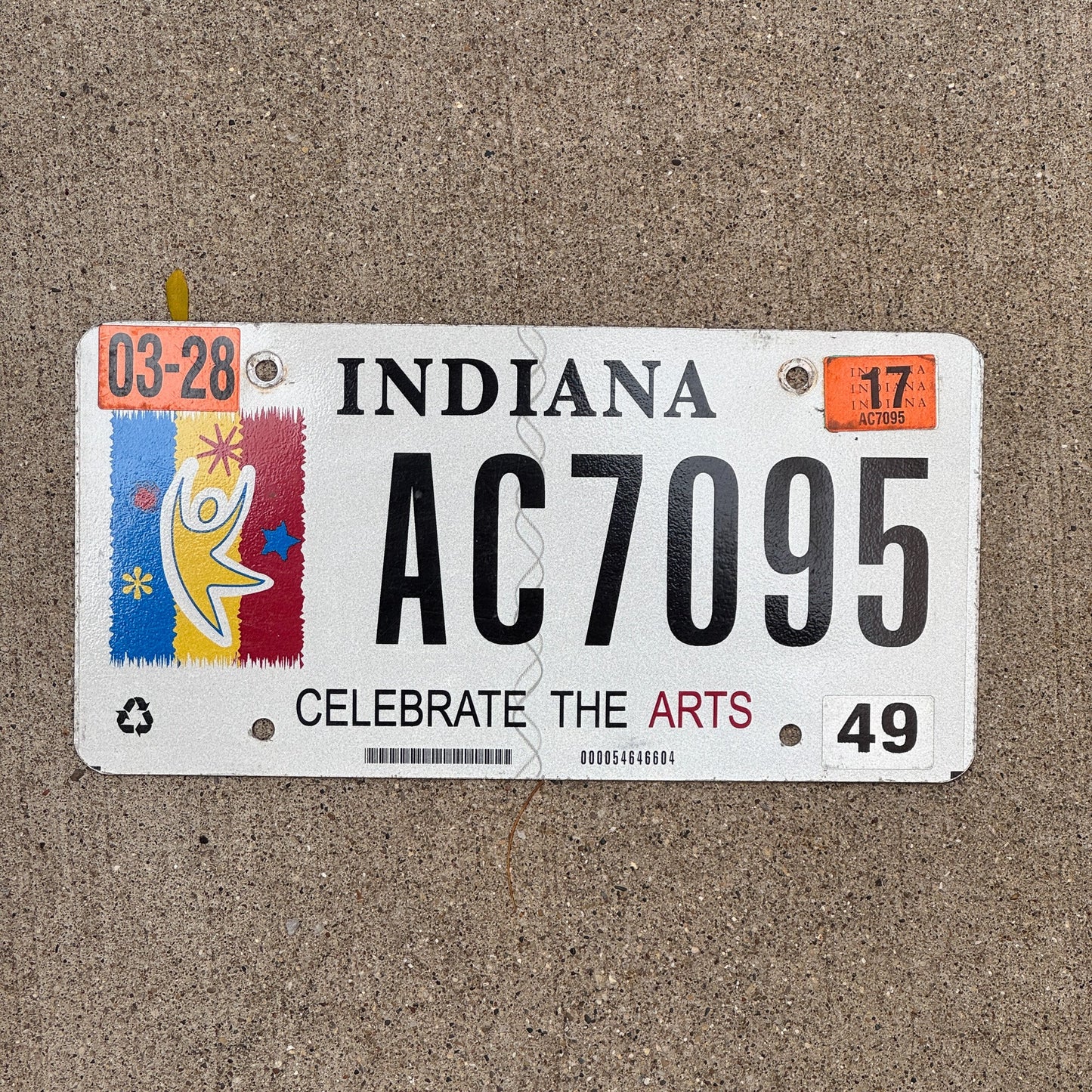 Photo of a 2012 2017 Indiana Graphic / Specialty License Plate Auto Tag Garage Decor Vintage Celebrate Arts Trust AC 7095 with original patina