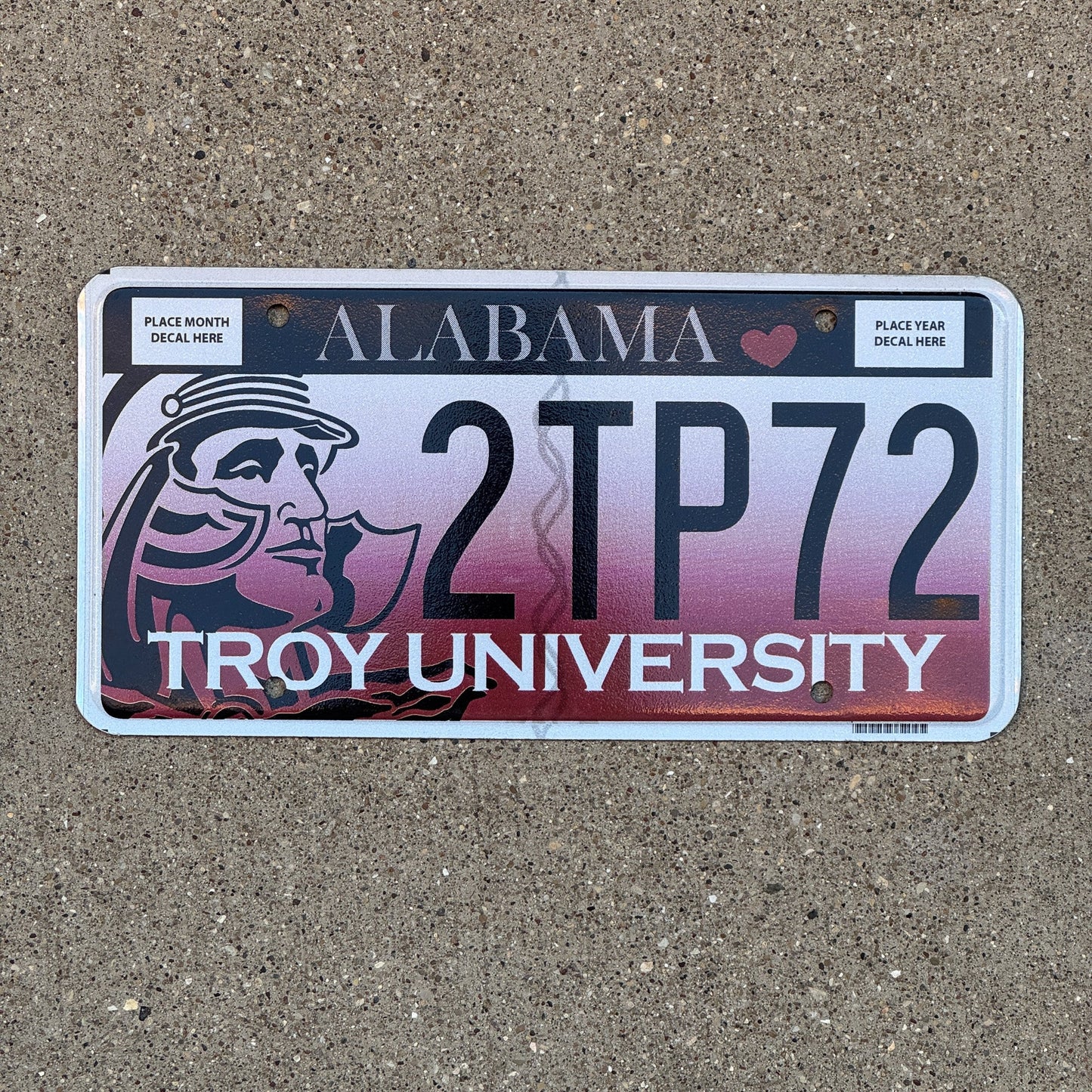 Photo of a 2012 Alabama Graphic / Specialty License Plate Auto Tag Garage Decor Vintage Troy State University 2 TP 72 with original patina