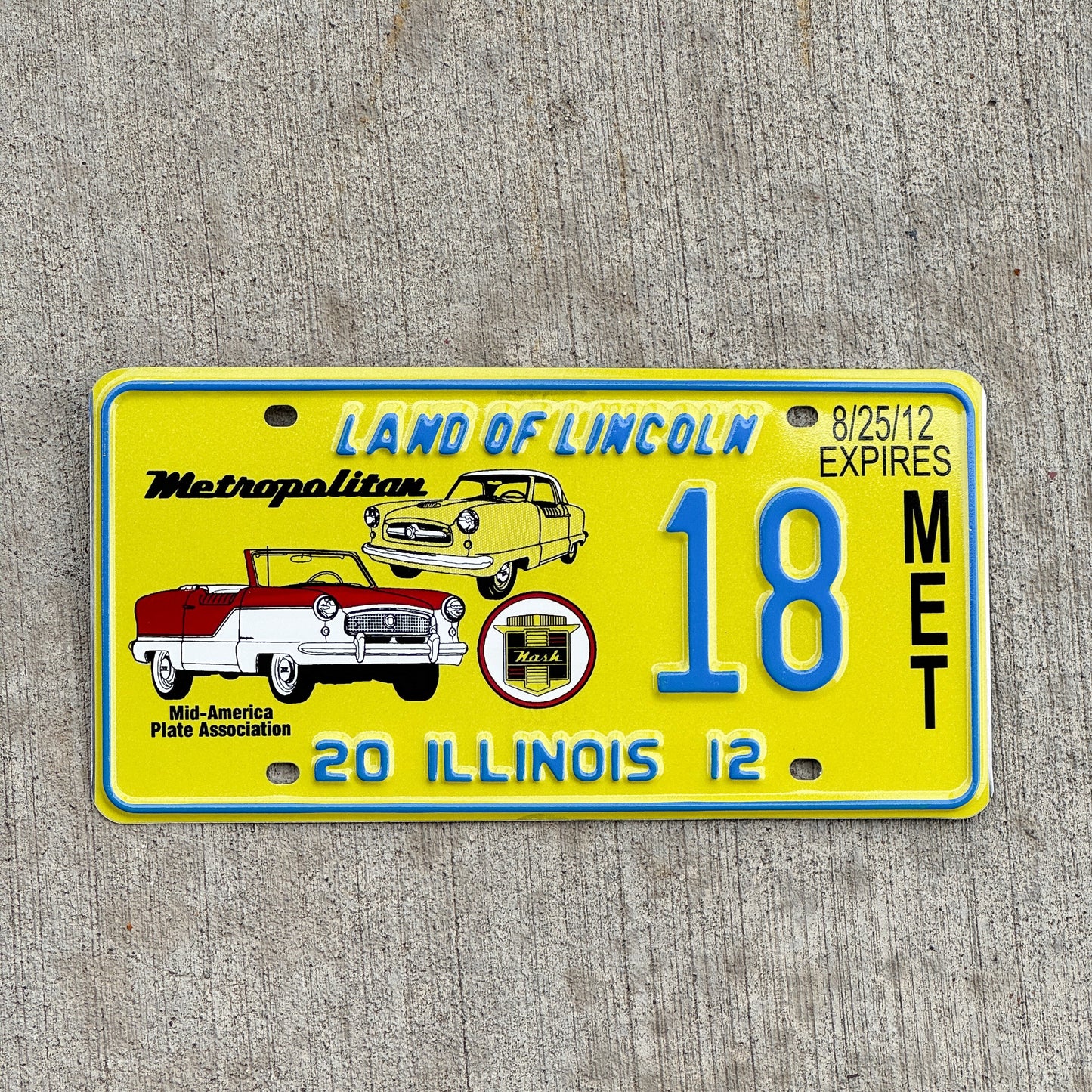 Photo of a 2012 Illinois Event License Plate Auto Tag Garage Decor Vintage Nash Metropolitan MAPA 18 with original patina