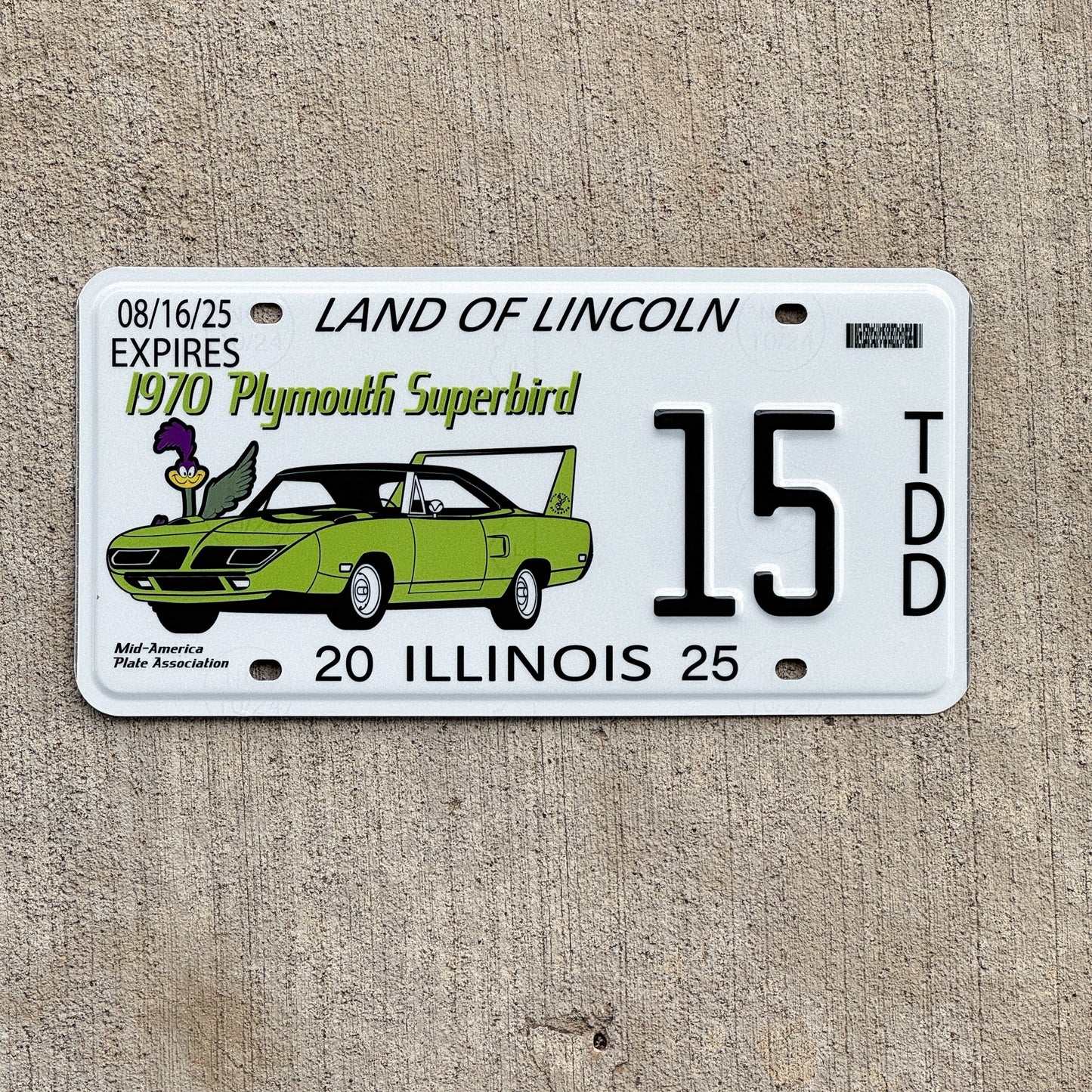 Photo of a 2025 Illinois Event License Plate Auto Tag 1 Vintage Garage Plymouth Superbird Two Digit 15 with original patina