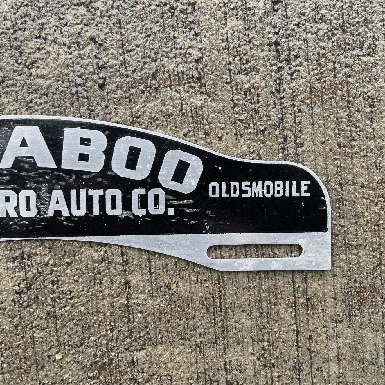1950 Era Baraboo Wisconsin License Plate Topper Auto Tag Oldsmobile Dealer Prothero Auto