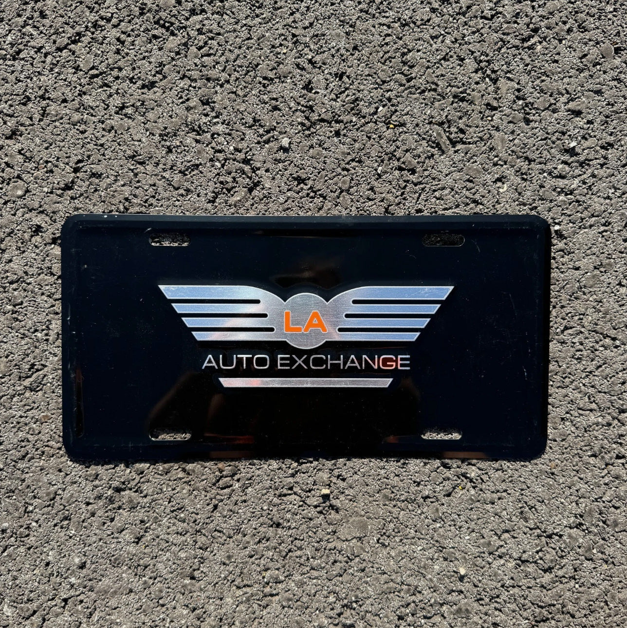 Photo of a Booster License Plate Auto Tag Garage Decor Vintage El Monte Montebello Montclair LA Auto Exchange Dealership