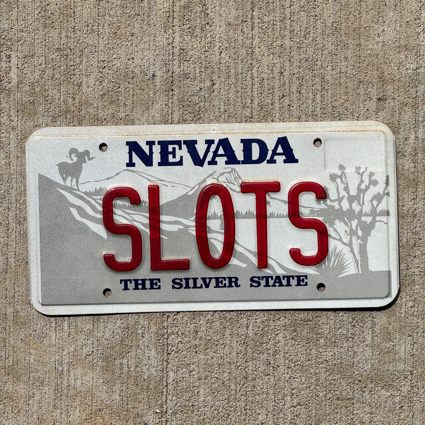 Photo of a Nevada SOUVENIR License Plate Auto Tag Garage Decor Vintage SLOTS
