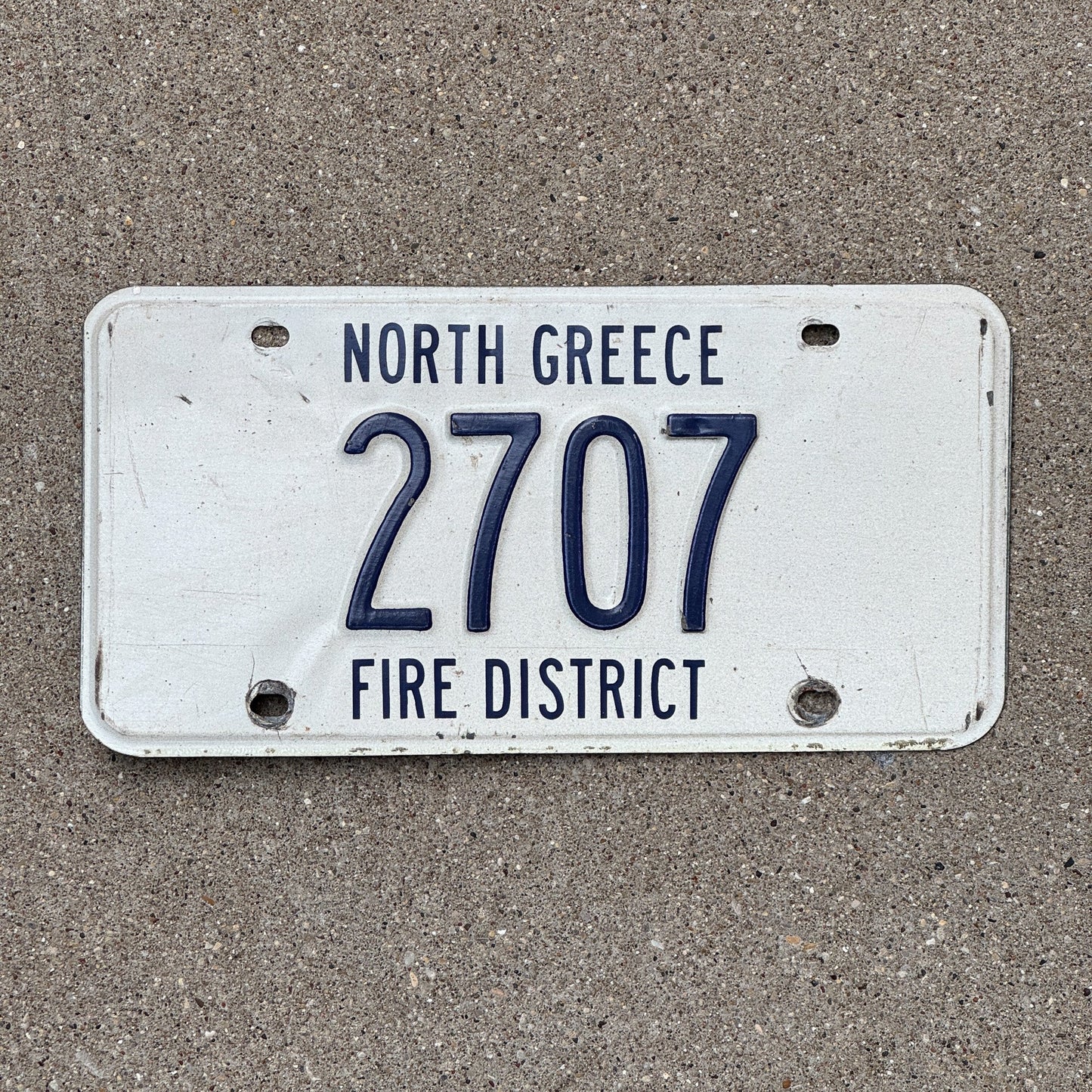 Photo of a New York North Greece Fire District License Plate Auto Tag Garage Decor Vintage Firefighter Fire Dept White 2707