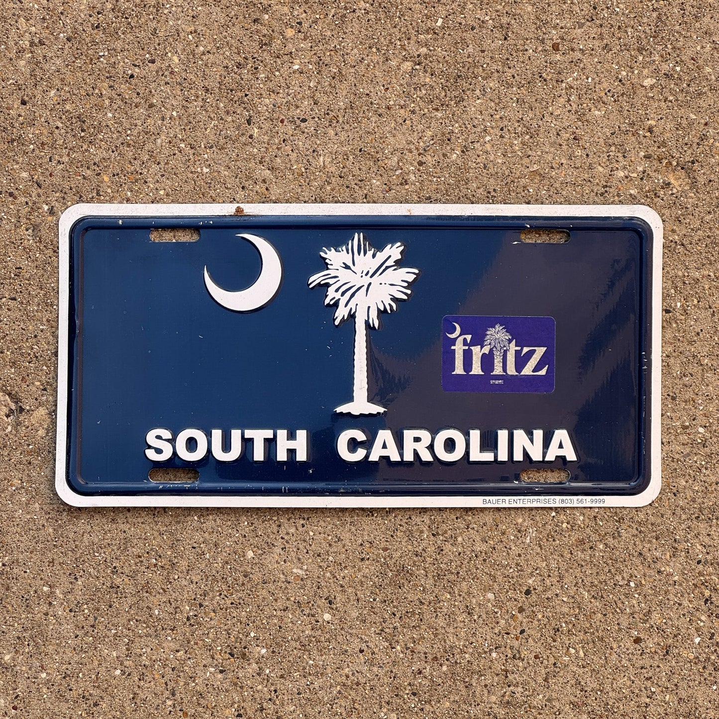 Photo of a South Carolina Booster License Plate Auto Tag Garage Decor Vintage Metal Flag Palm Tree Graphic Logo