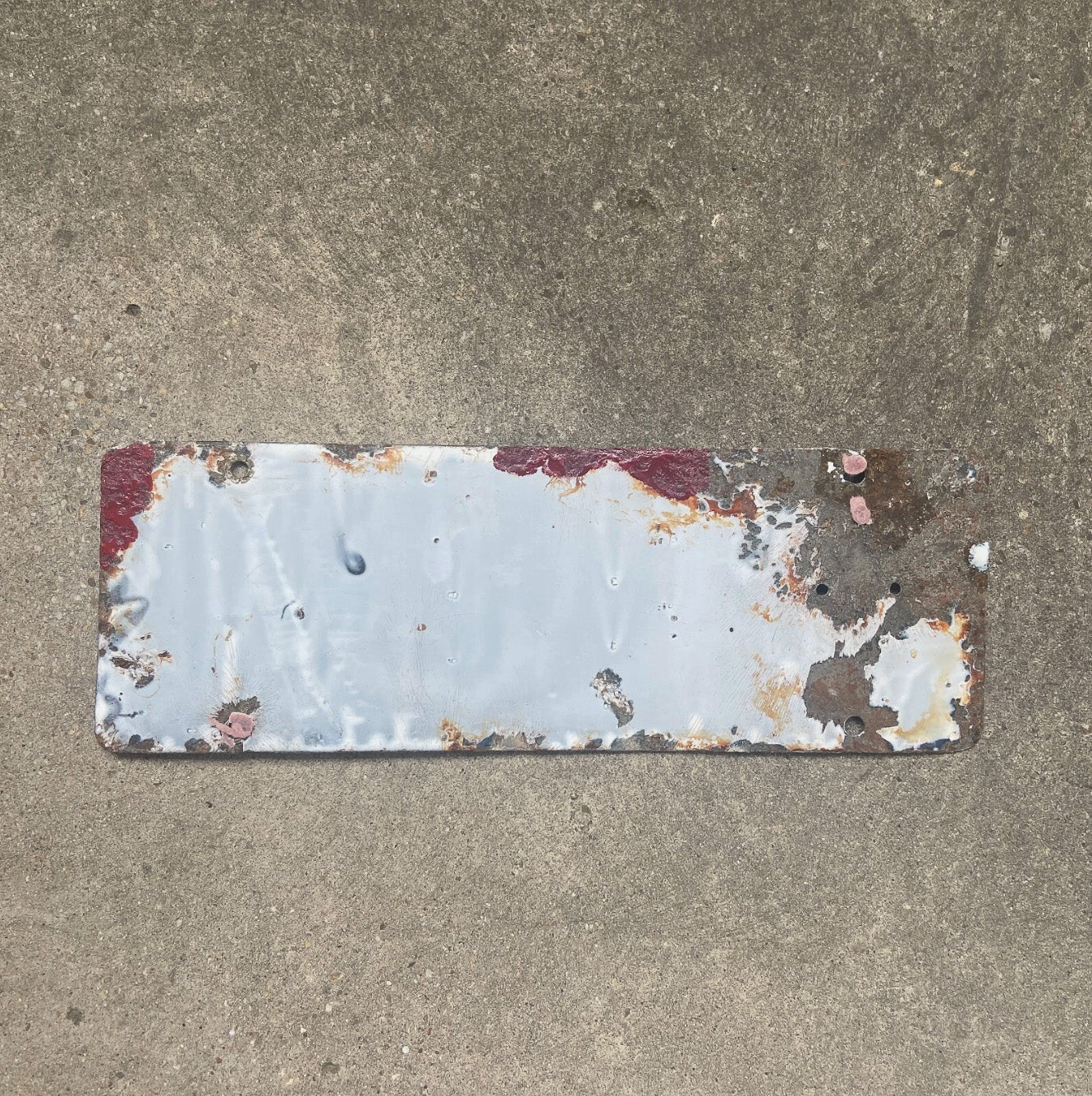 A detail view (back side) of the 1916 California porcelain license plate.