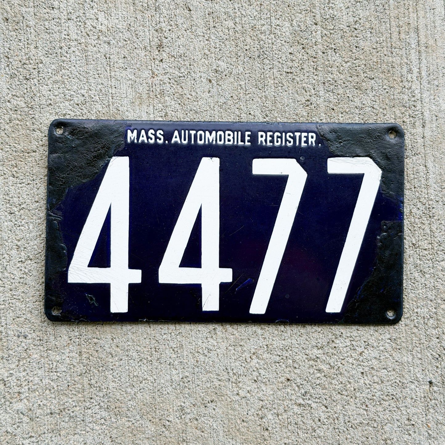 Photo of a 1903 1904 Massachusetts Porcelain License Plate Auto Tag Garage Decor Vintage Mass Automobile Register Small Font Four Digit 4477 with original patina