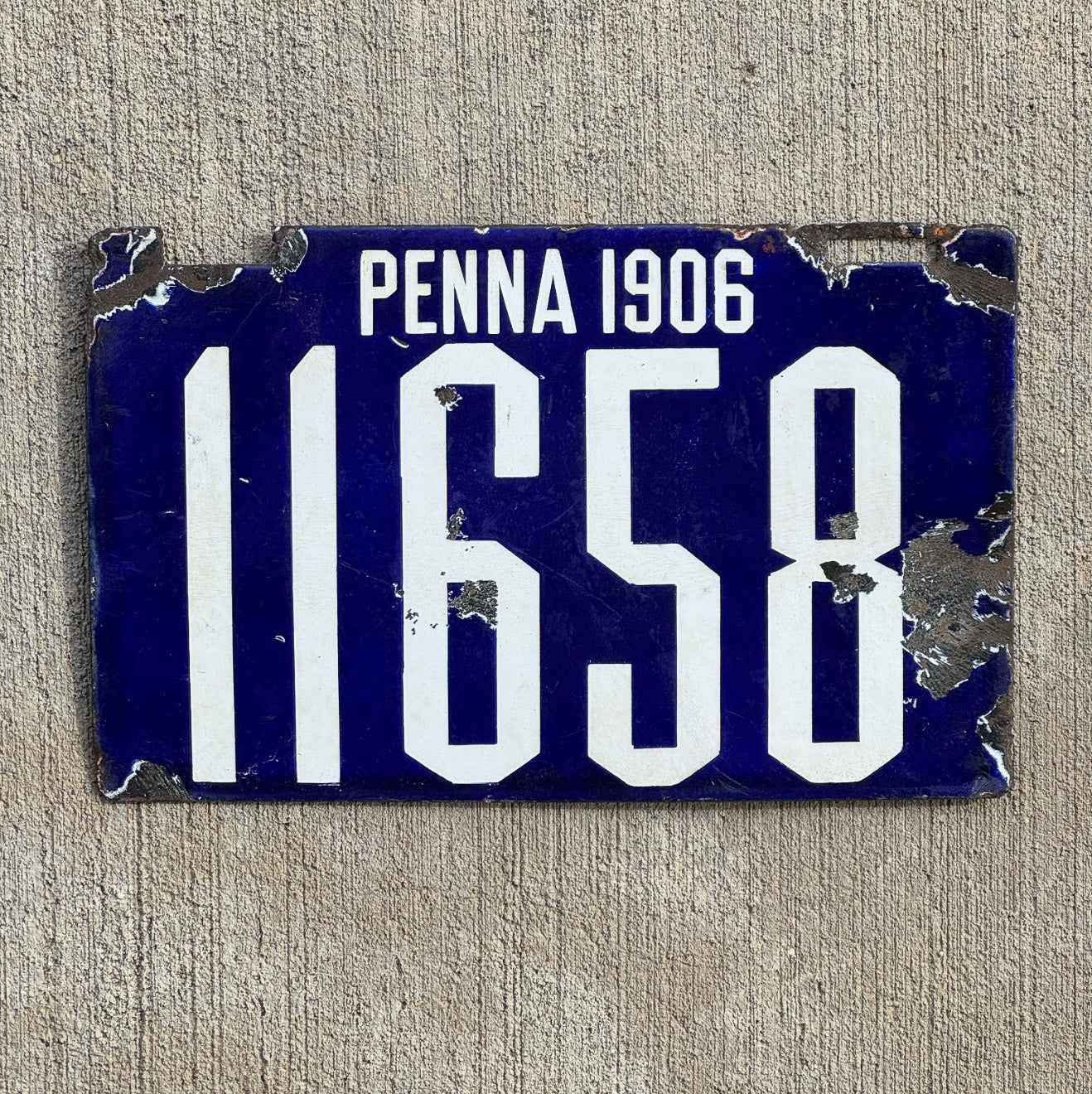 Photo of a 1906 Pennsylvania Porcelain License Plate Auto Tag Garage Decor Vintage First Issue 11658 with original patina