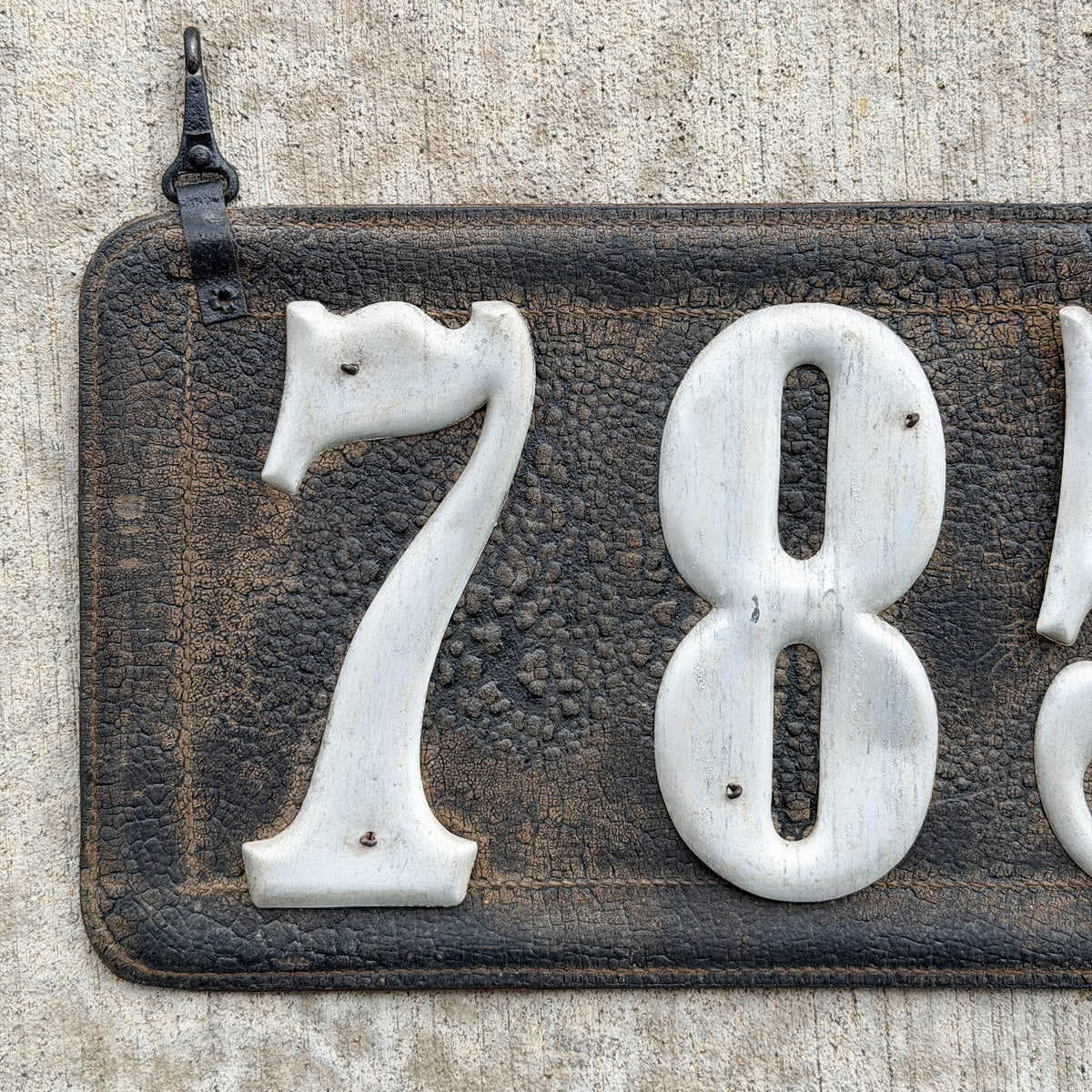 Photo of a 1907 1917 Texas Leather License Plate Auto Tag Garage Decor Vintage Low Number Three Digit 785 with original patina