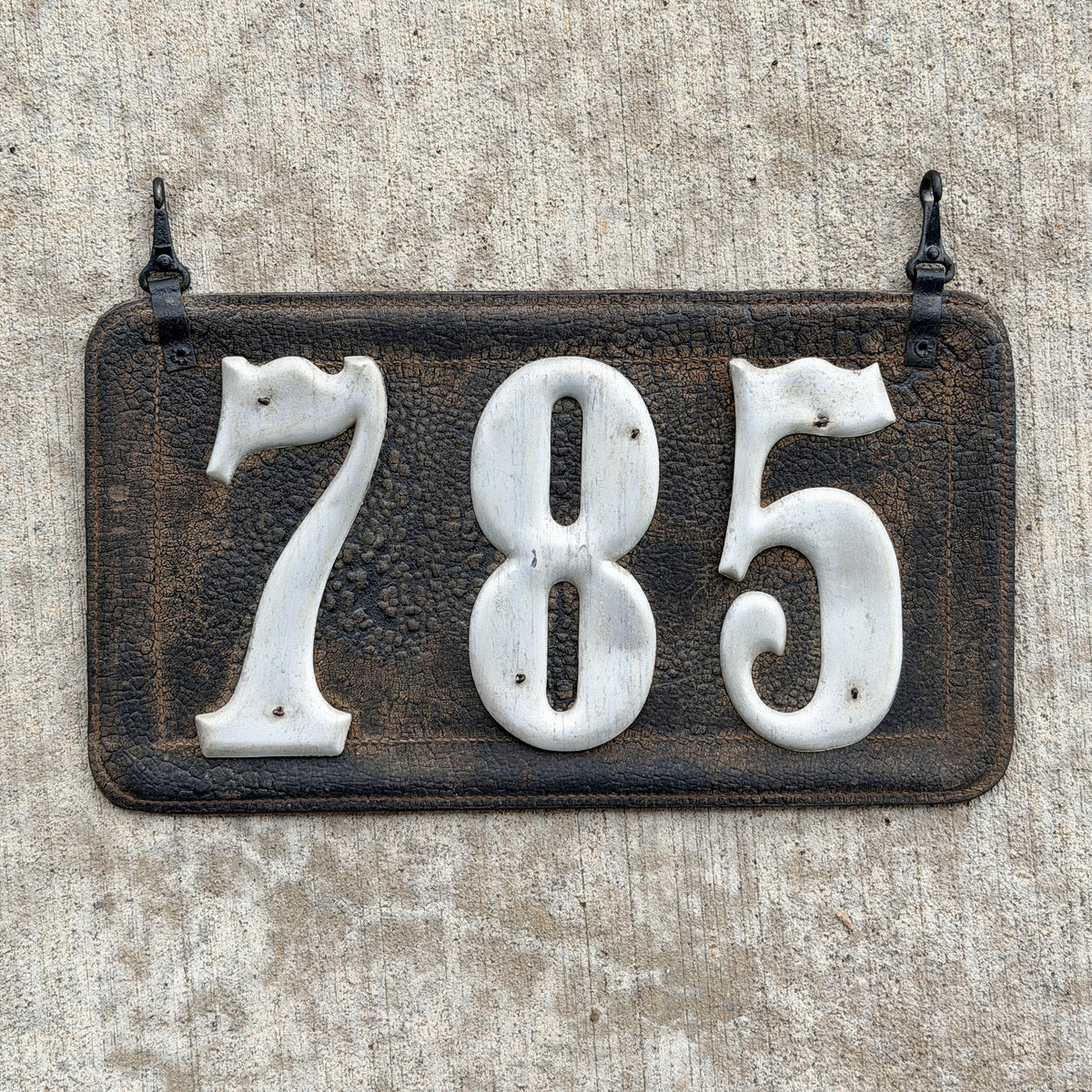 Photo of a 1907 1917 Texas Leather License Plate Auto Tag Garage Decor Vintage Low Number Three Digit 785 with original patina