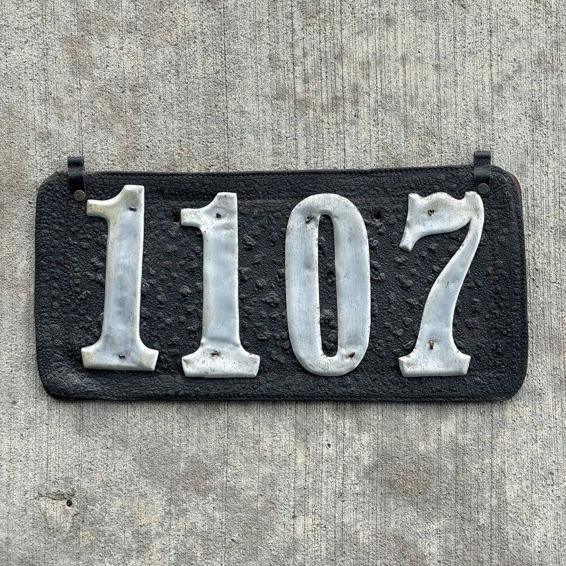 Photo of a 1907 1917 Texas Leather Prestate License Plate Auto Tag Garage Decor Vintage 1107 with original patina