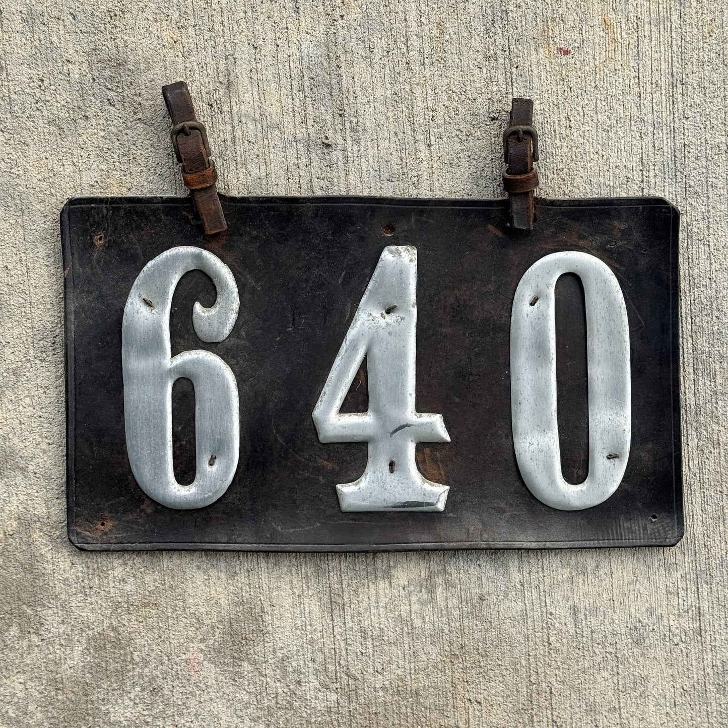 Photo of a 1907 1917 Texas Leather Prestate License Plate Auto Tag Garage Decor Vintage Low Number Three Digit 640 with original patina