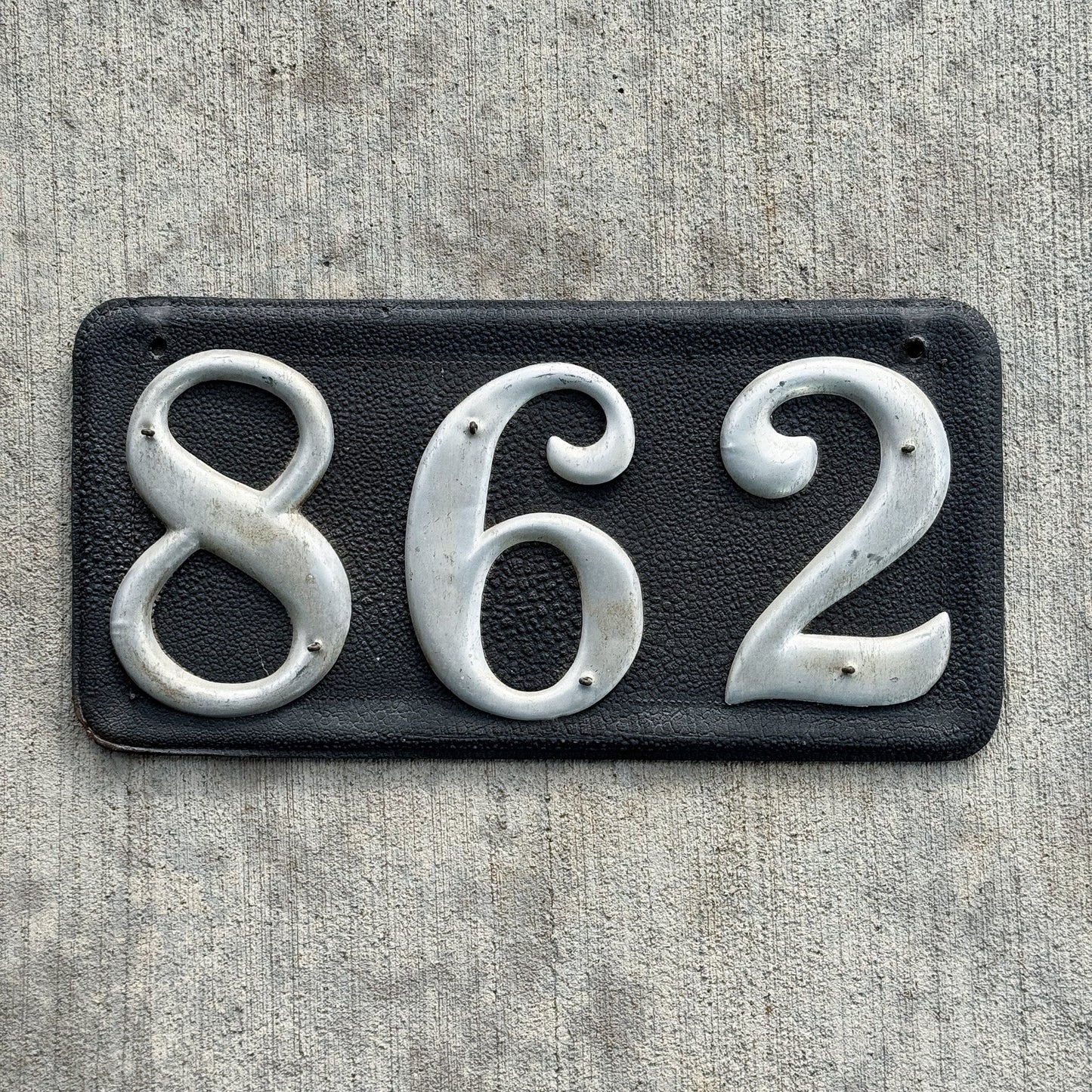 Photo of a 1907 1917 Texas Leather Prestate License Plate Auto Tag Garage Decor Vintage Low Number Three Digit 862 with original patina
