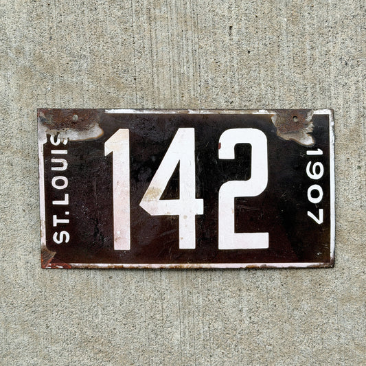 Photo of a 1907 Missouri Porcelain License Plate Auto Tag Garage Low Number Three Digit 142 with original patina