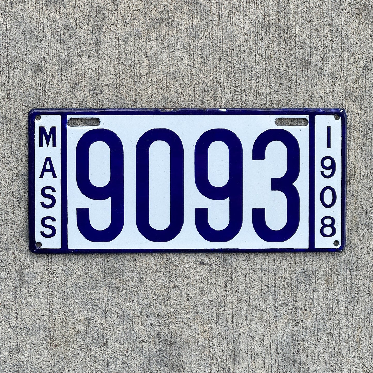 Photo of a 1908 Massachusetts Porcelain License Plate Auto Tag 1 Vintage Garage Low Number Four Digit High Quality 9093 with original patina