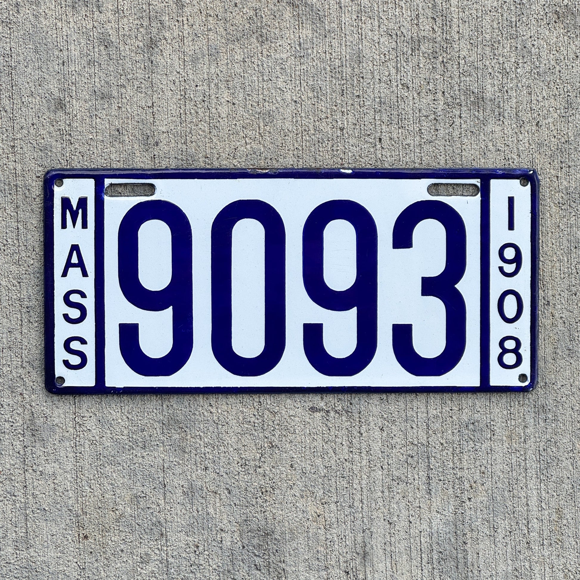 Photo of a 1908 Massachusetts Porcelain License Plate Auto Tag 1 Vintage Garage Low Number Four Digit High Quality 9093 with original patina