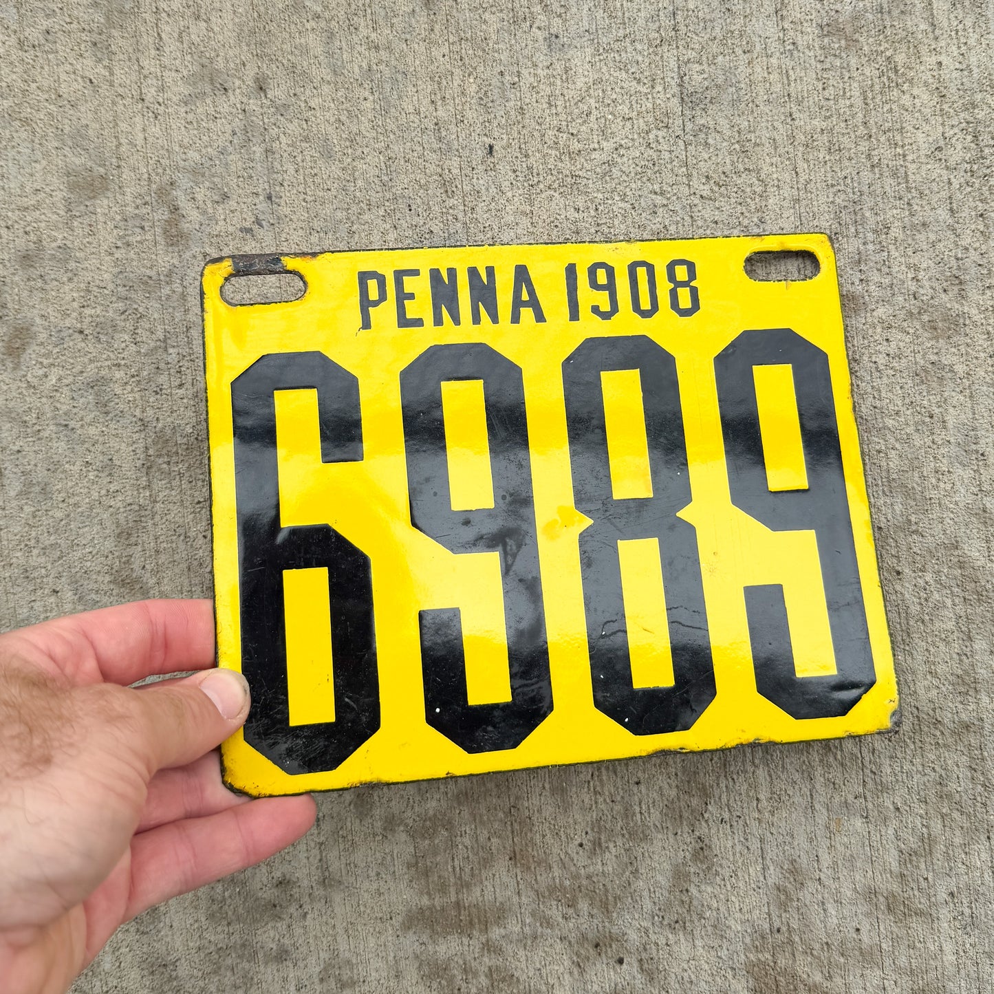 Photo of a 1908 Pennsylvania Porcelain License Plate Auto Tag Garage Decor Vintage High Quality Low Number Four Digit 6989 with original patina